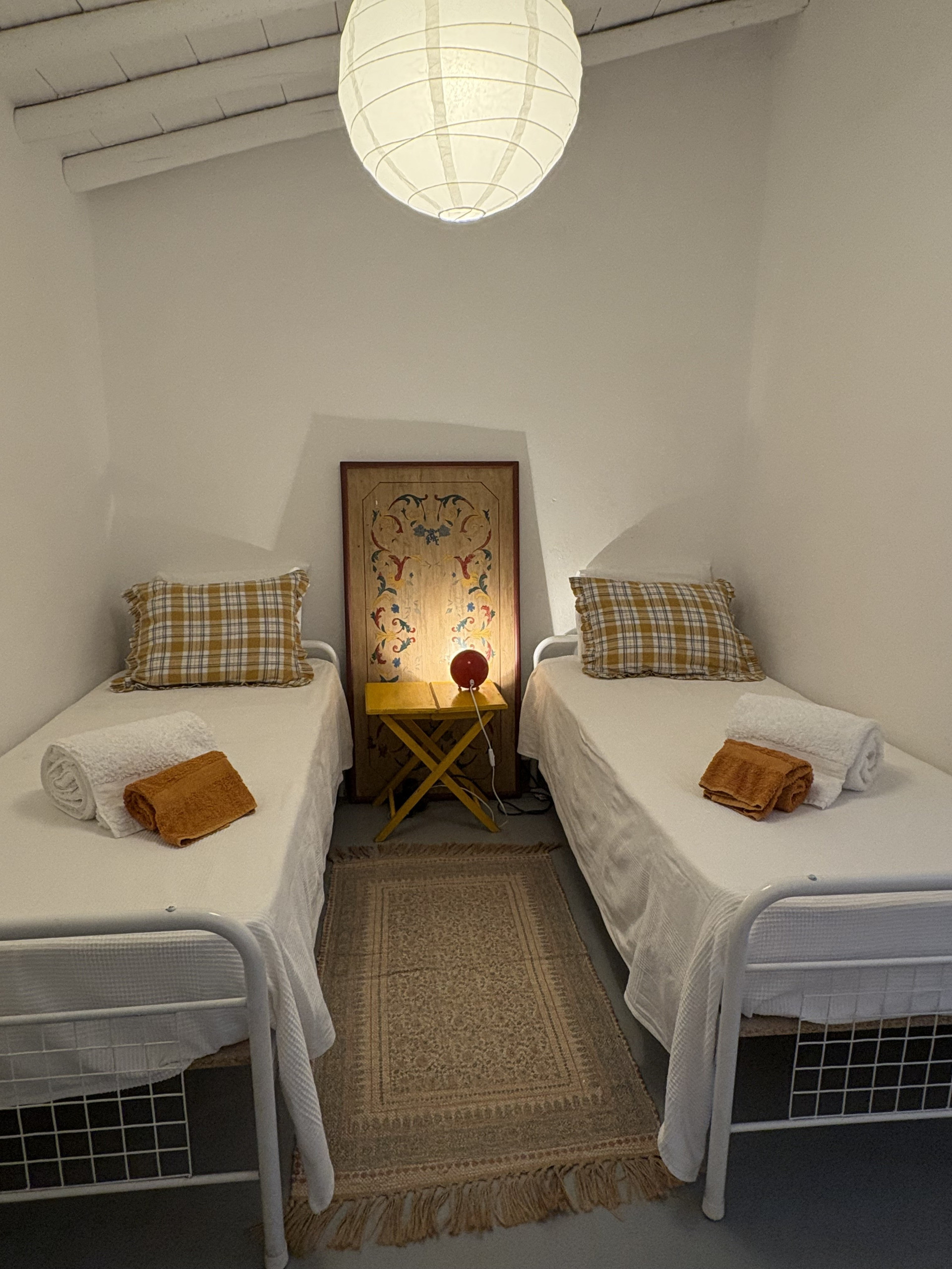 Twin bedroom with cozy bedding