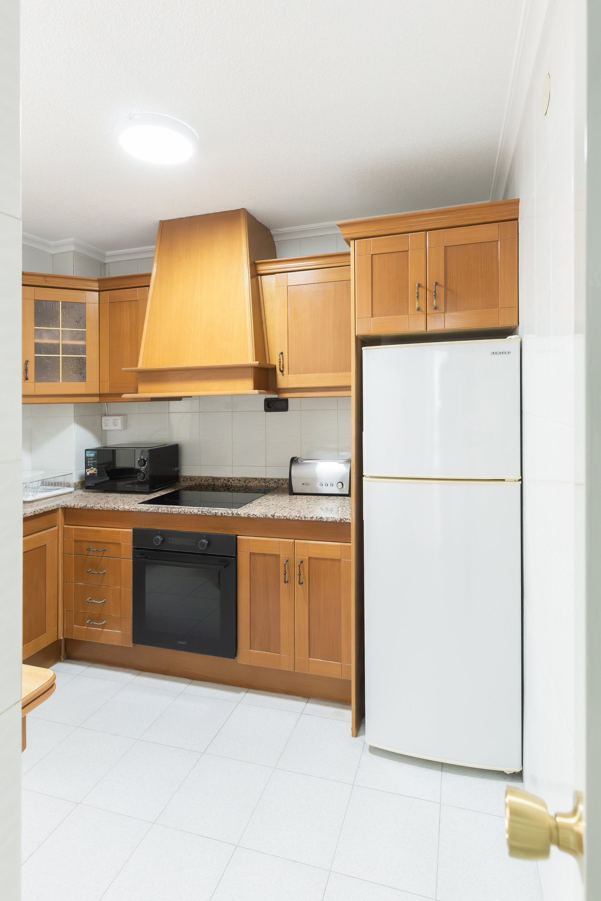 Kitchen with wooden cabinets