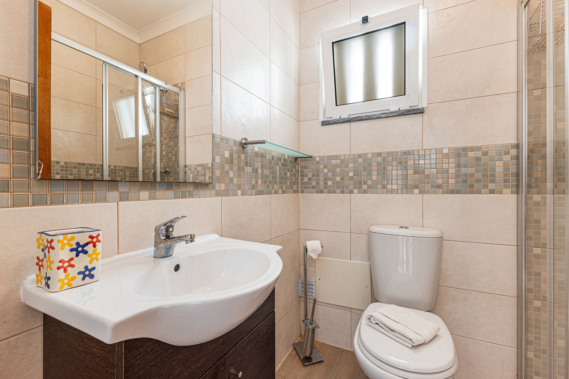 Bathroom with shower and vanity