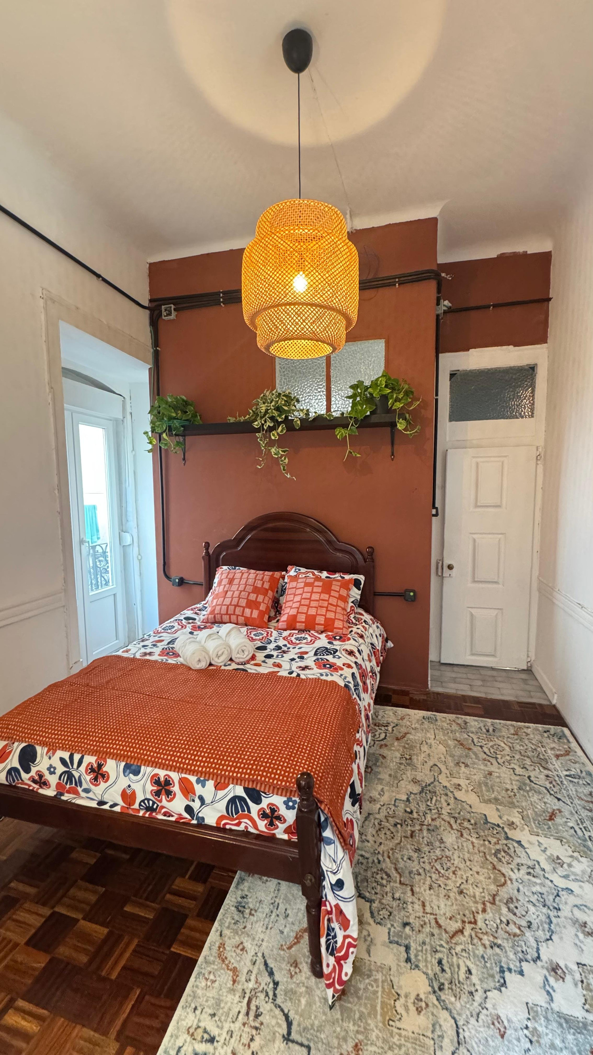 Bedroom with terracotta accent wall
