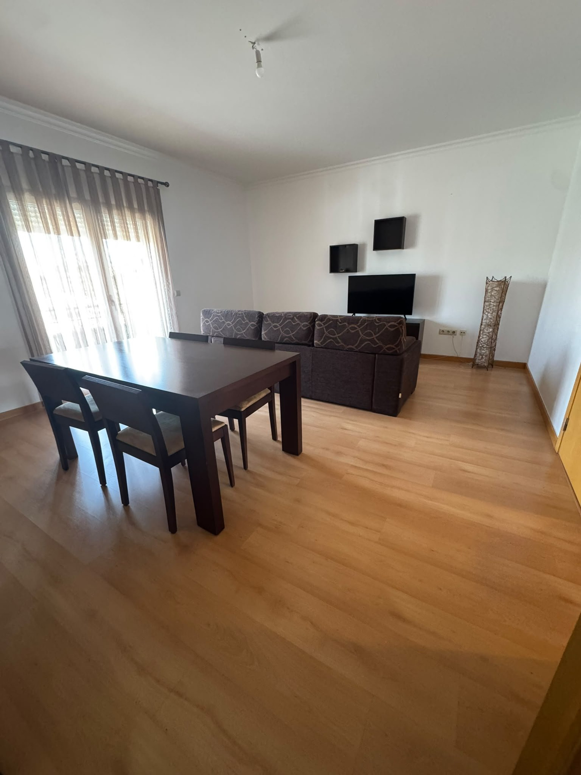 Living and dining area with sofa