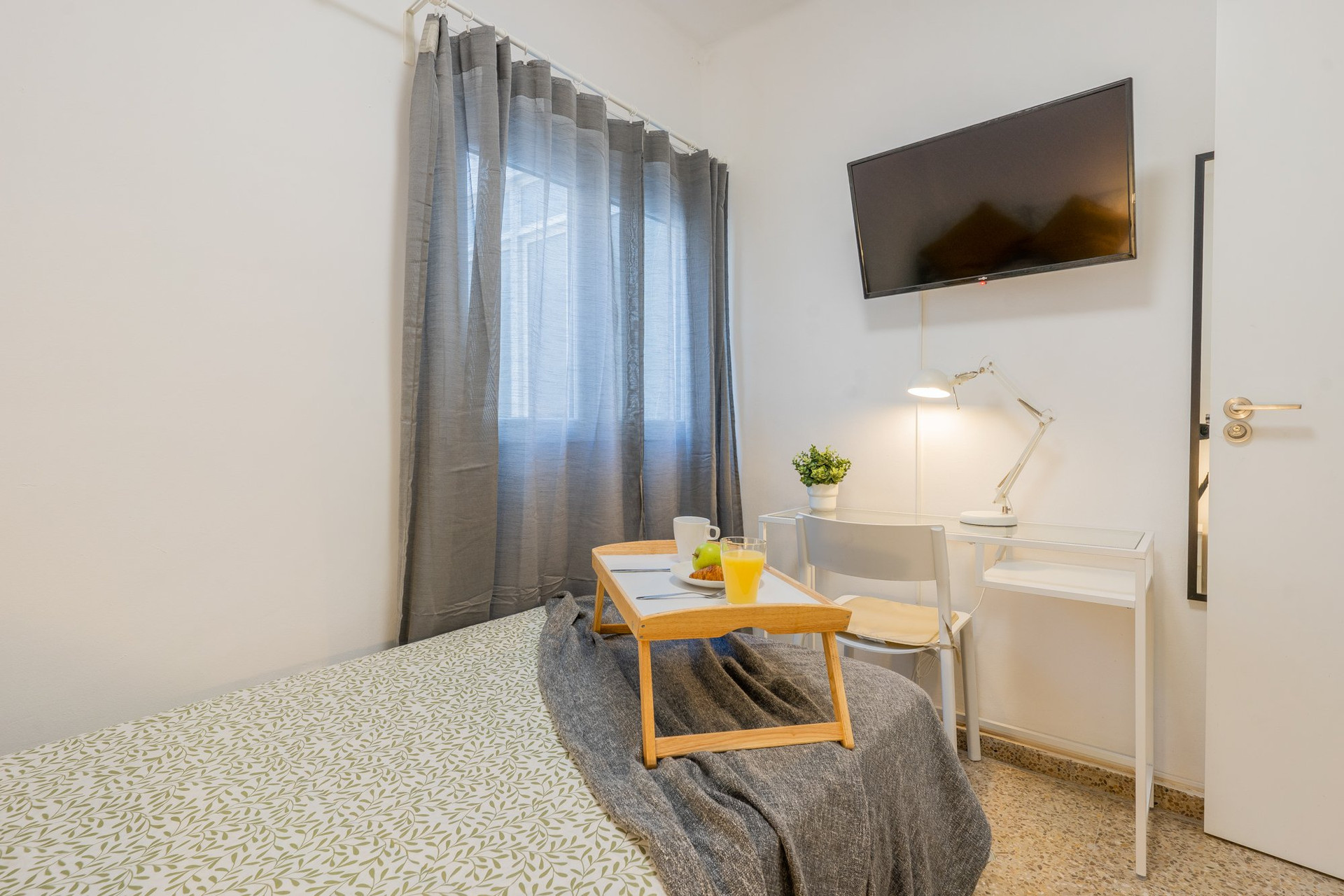 Bedroom with TV and desk