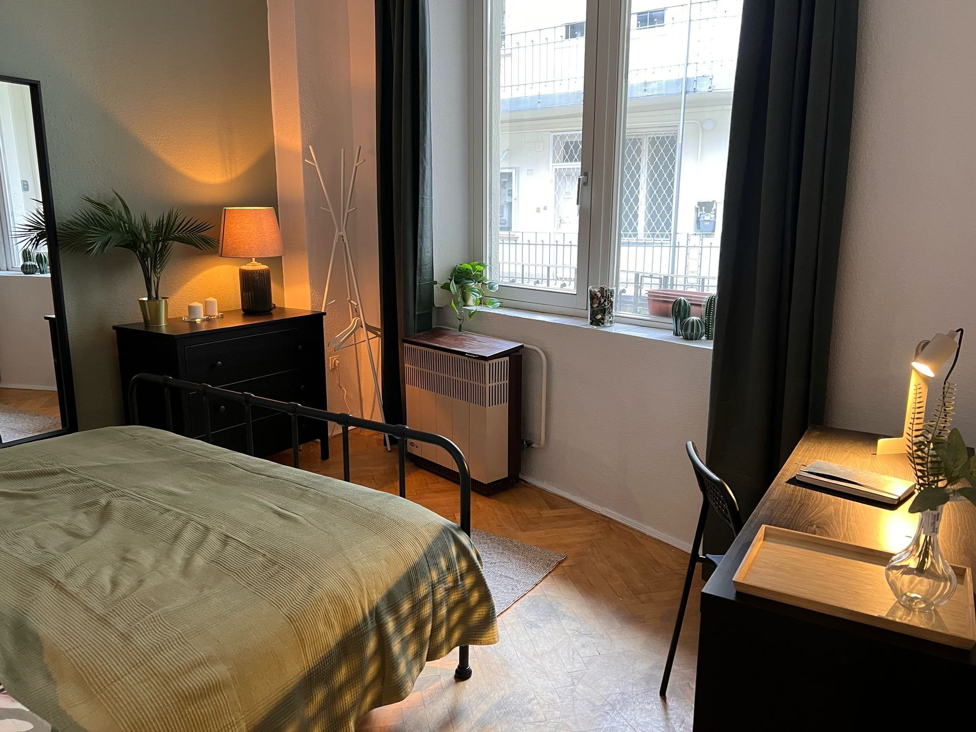 Bright bedroom with window and desk