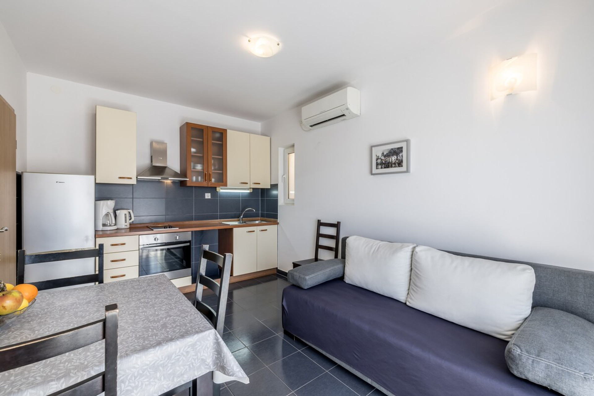 Fully equipped kitchen with dining area.