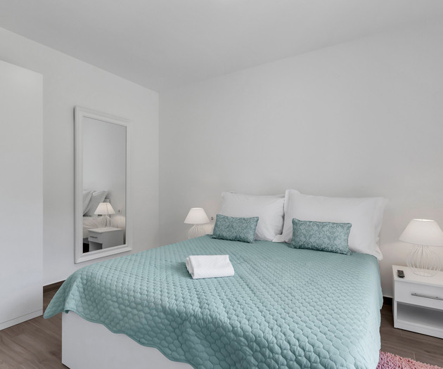Bright bedroom with double bed