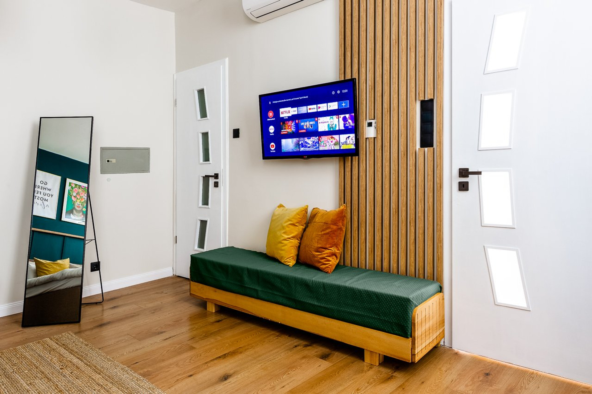 Living area TV daybed and mirror