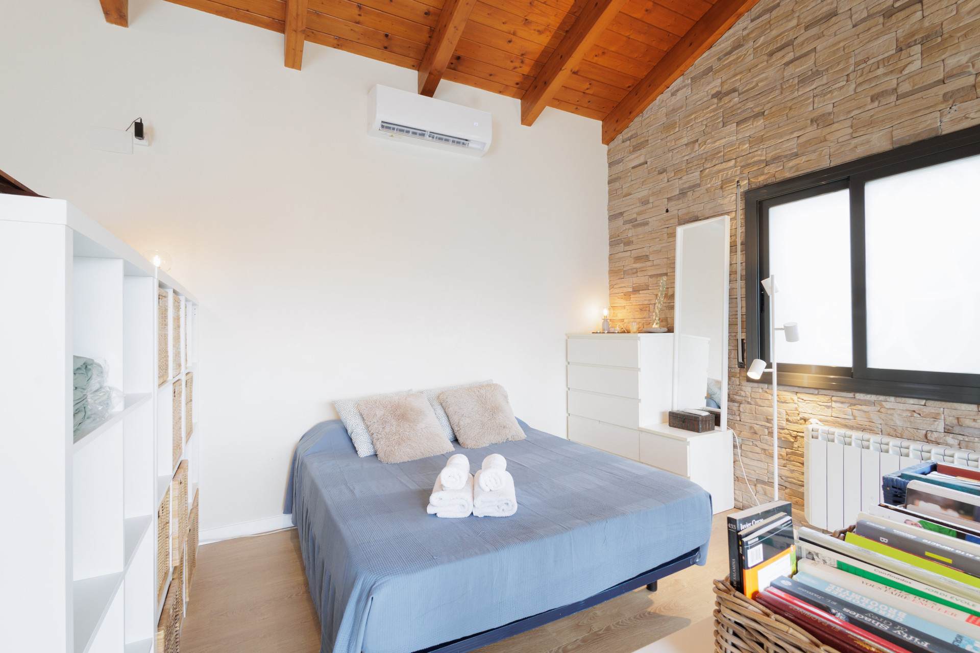 Bright bedroom with wooden ceiling