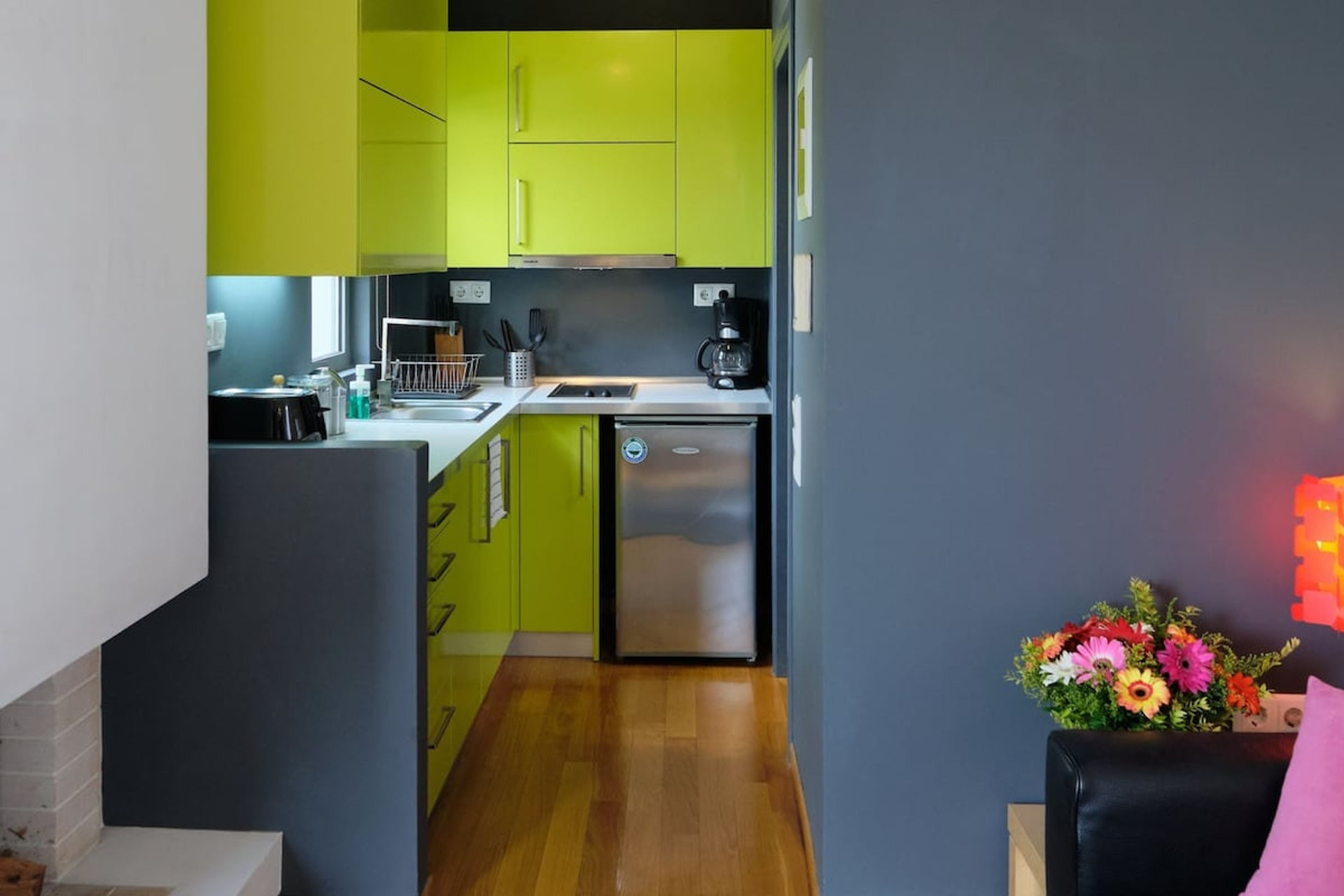 Fireplace, kitchenette & sofa