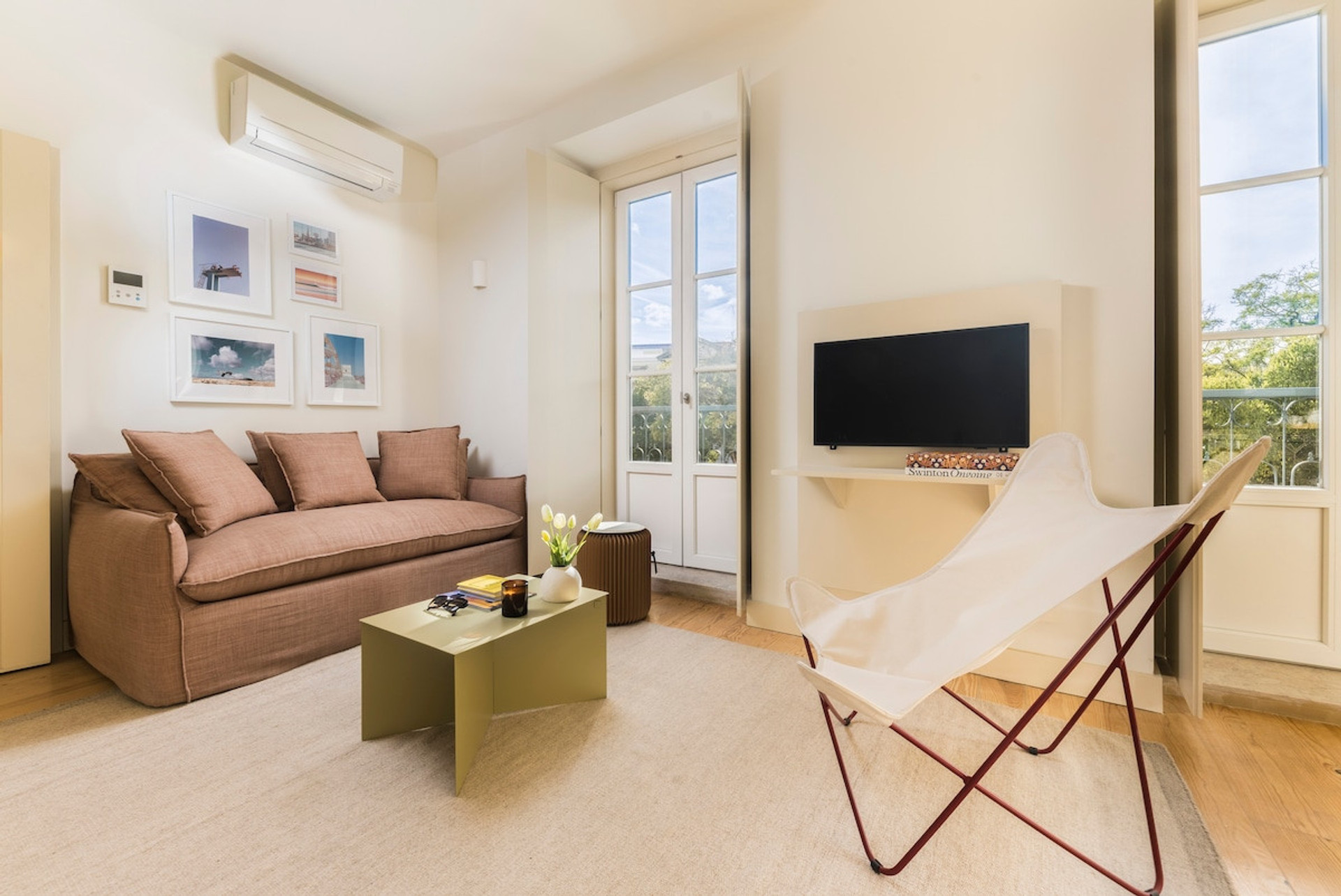 Comfortable living area with sofa and TV, perfect for unwinding.