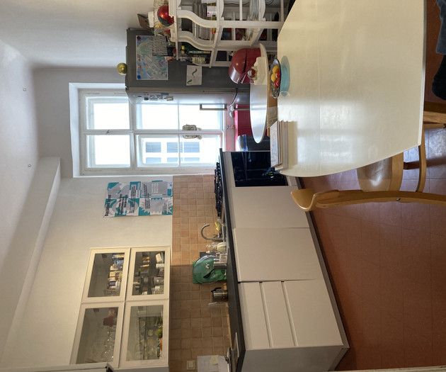 Kitchen with cabinets and window