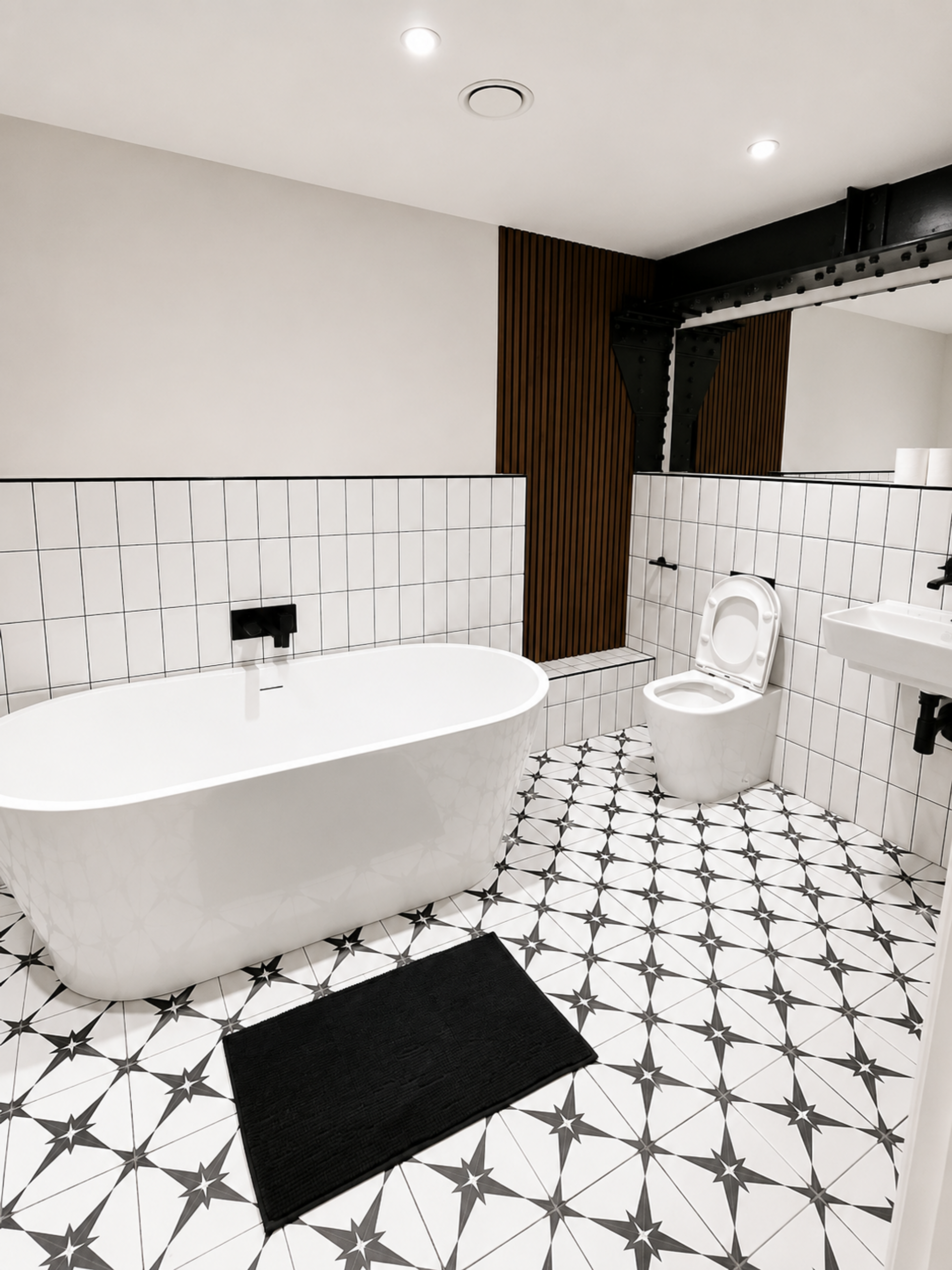 Bathroom freestanding tub with patterned tiles