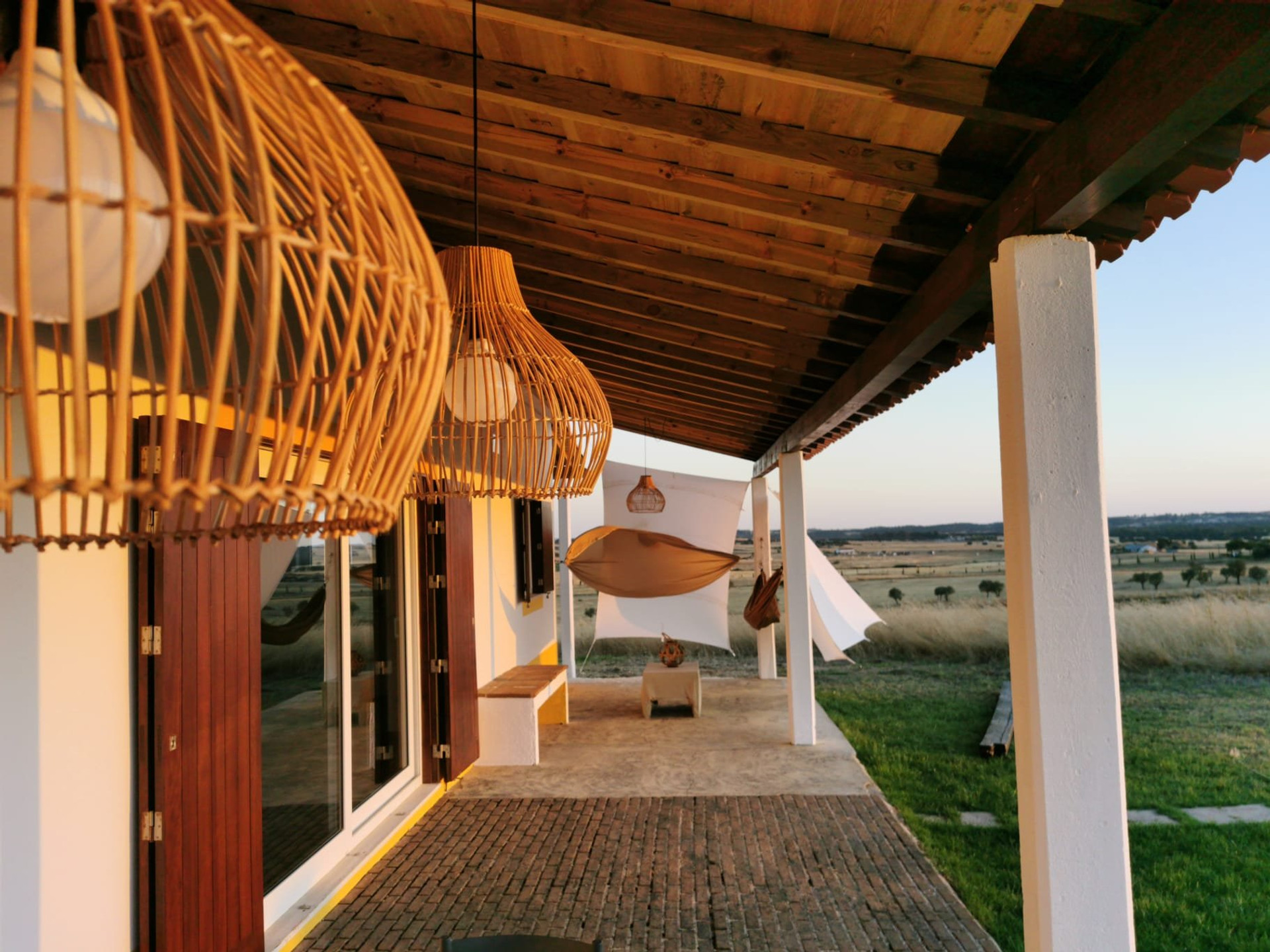 Covered terrace with rattan pendants