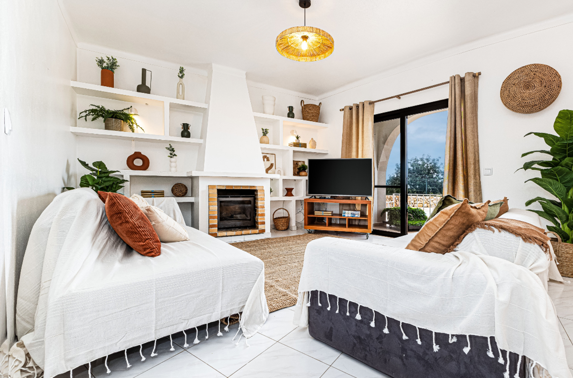 Living room with fireplace and TV