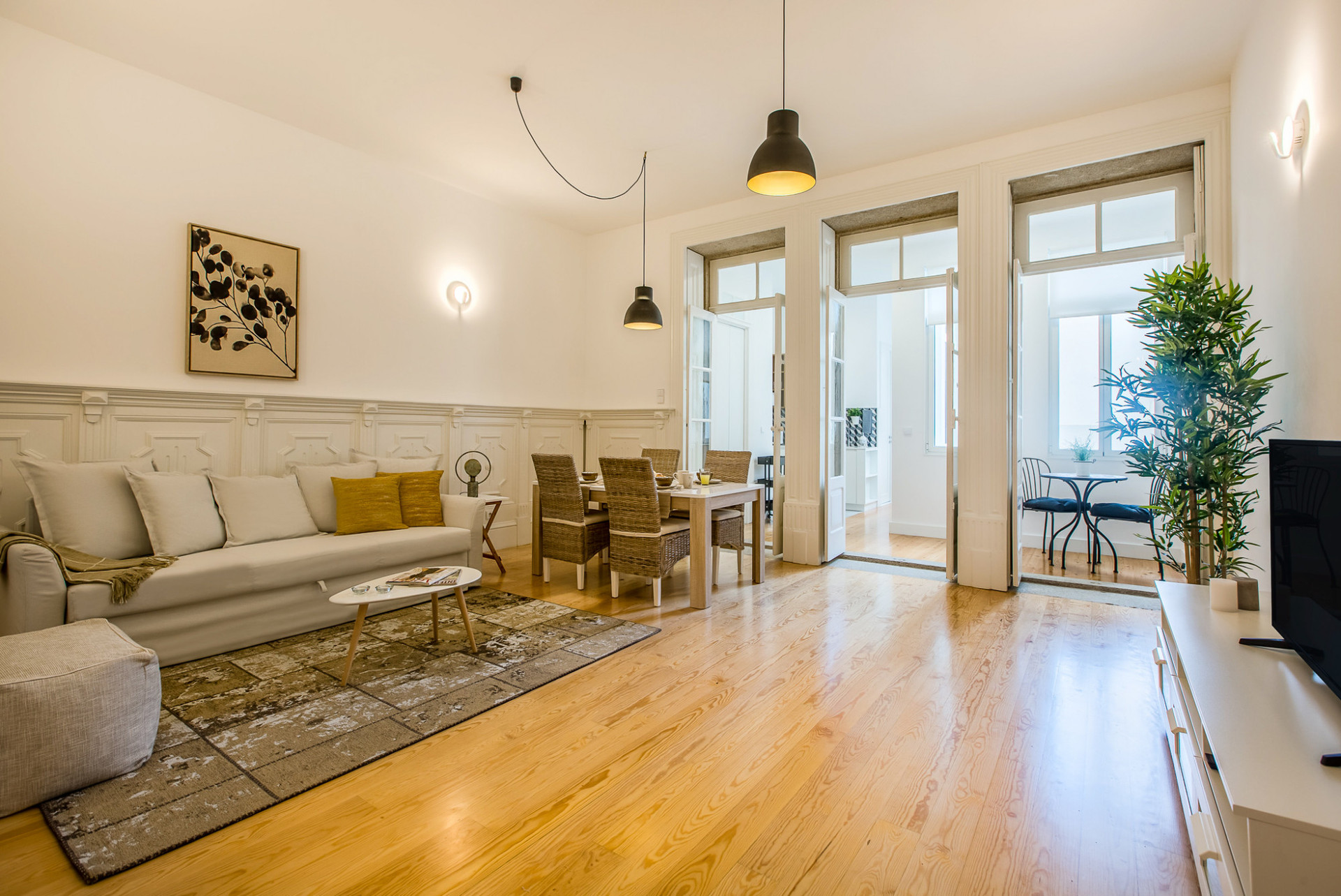 Living Room with TV, Sofa and Dining Table