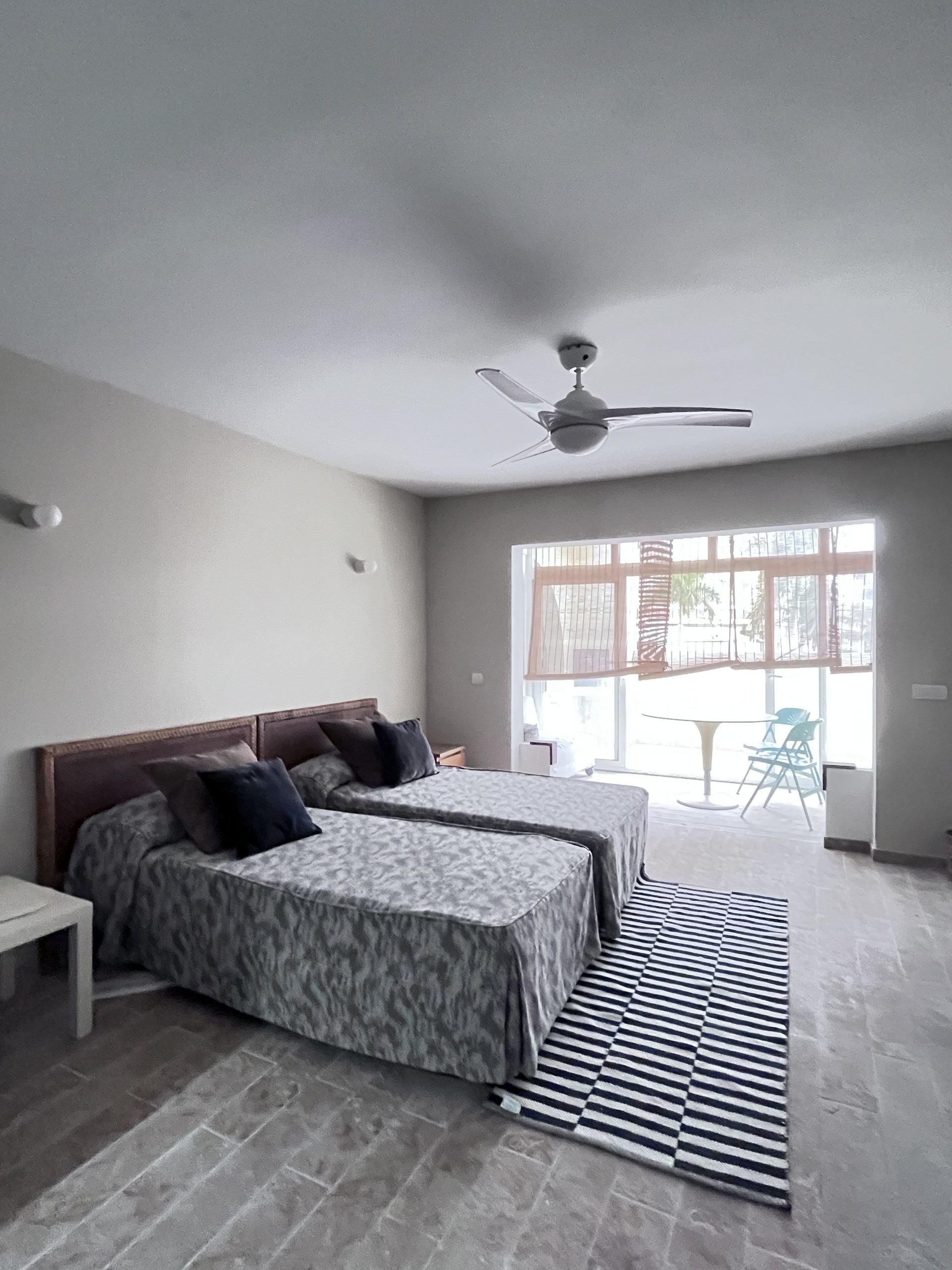 Bedroom with twin beds and rug