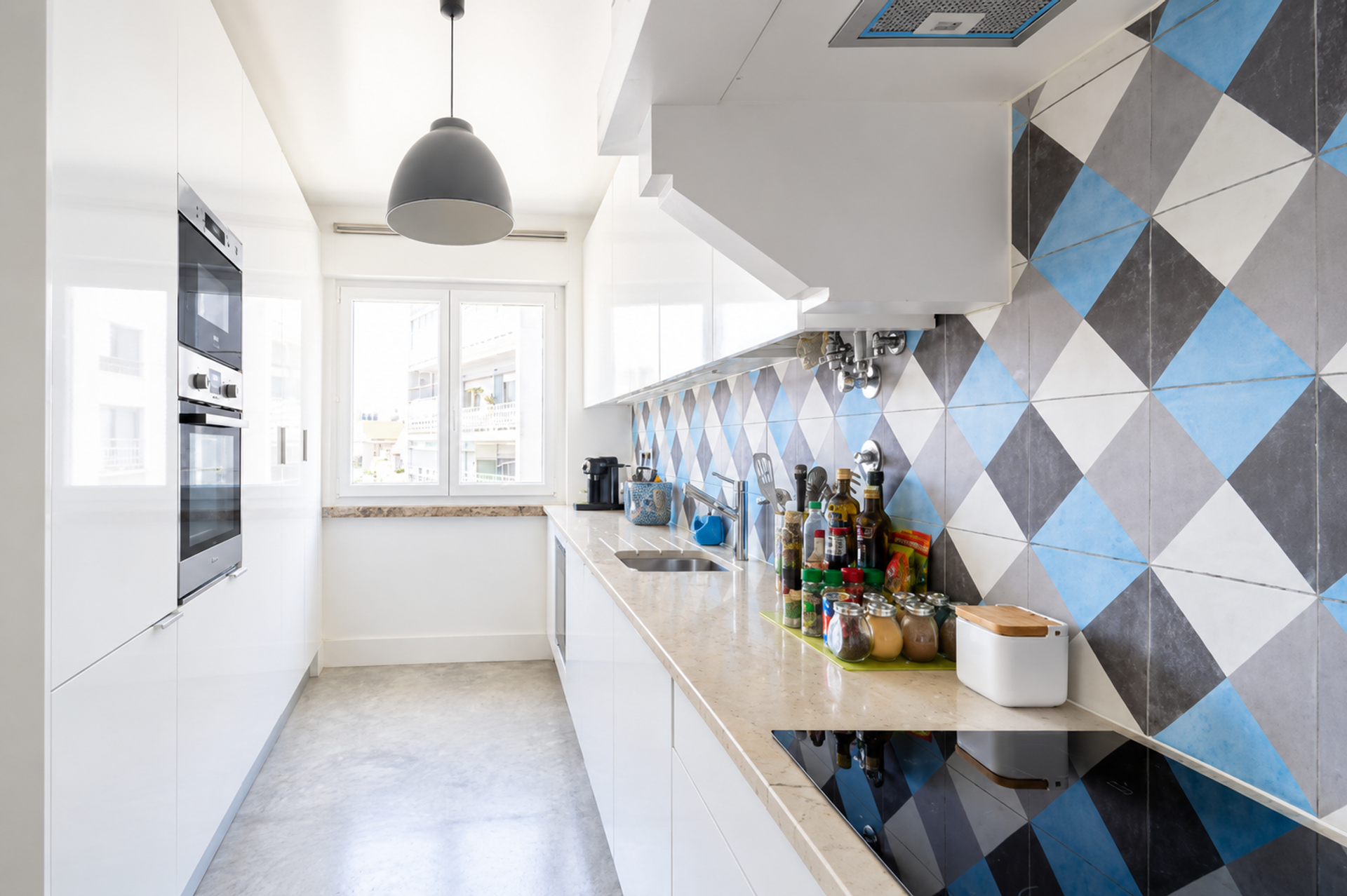 White kitchen geometric tile backsplash
