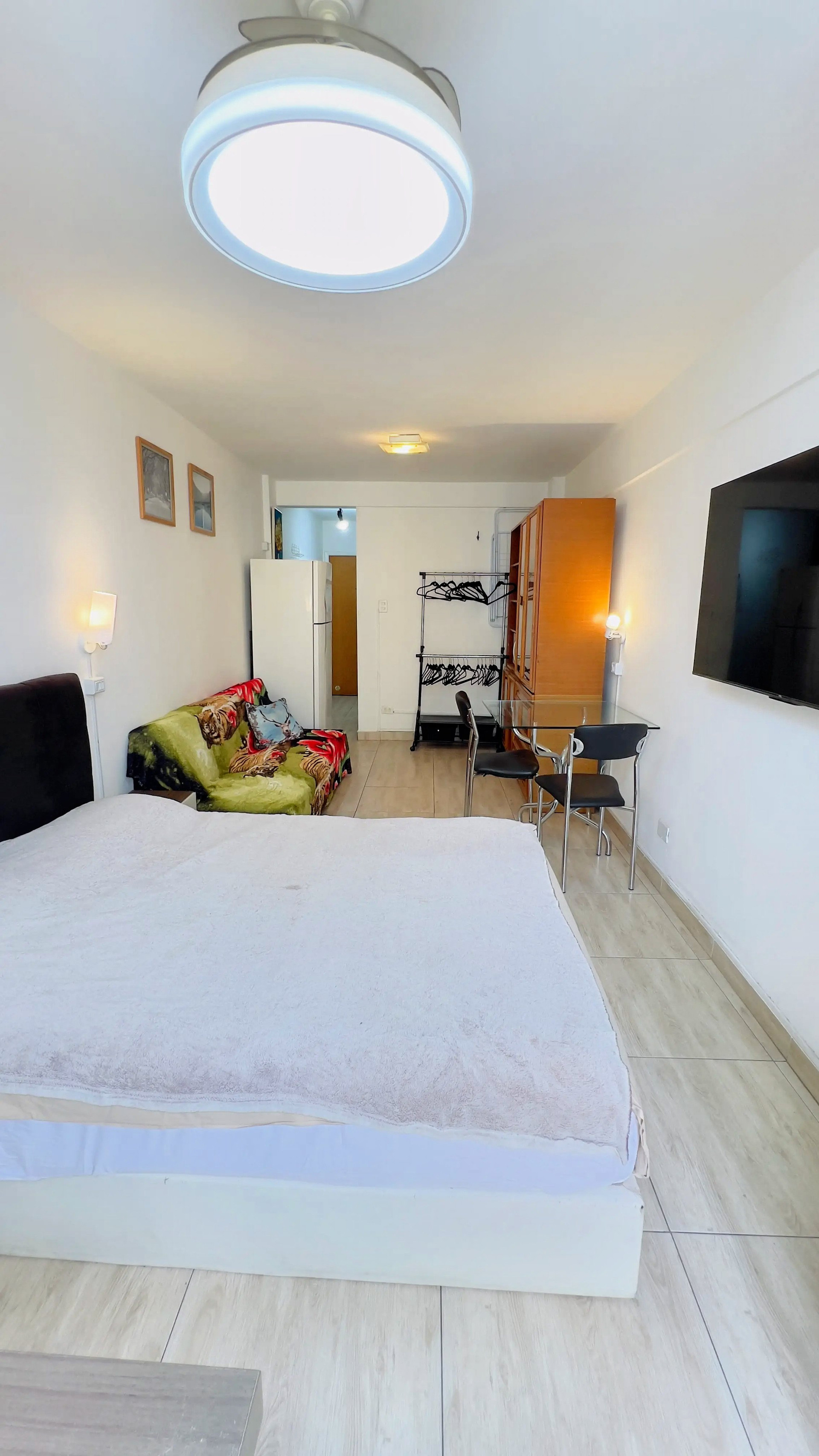 Studio bedroom with bed sofa TV