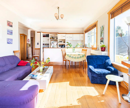 Red beach house overlooking 3 seas