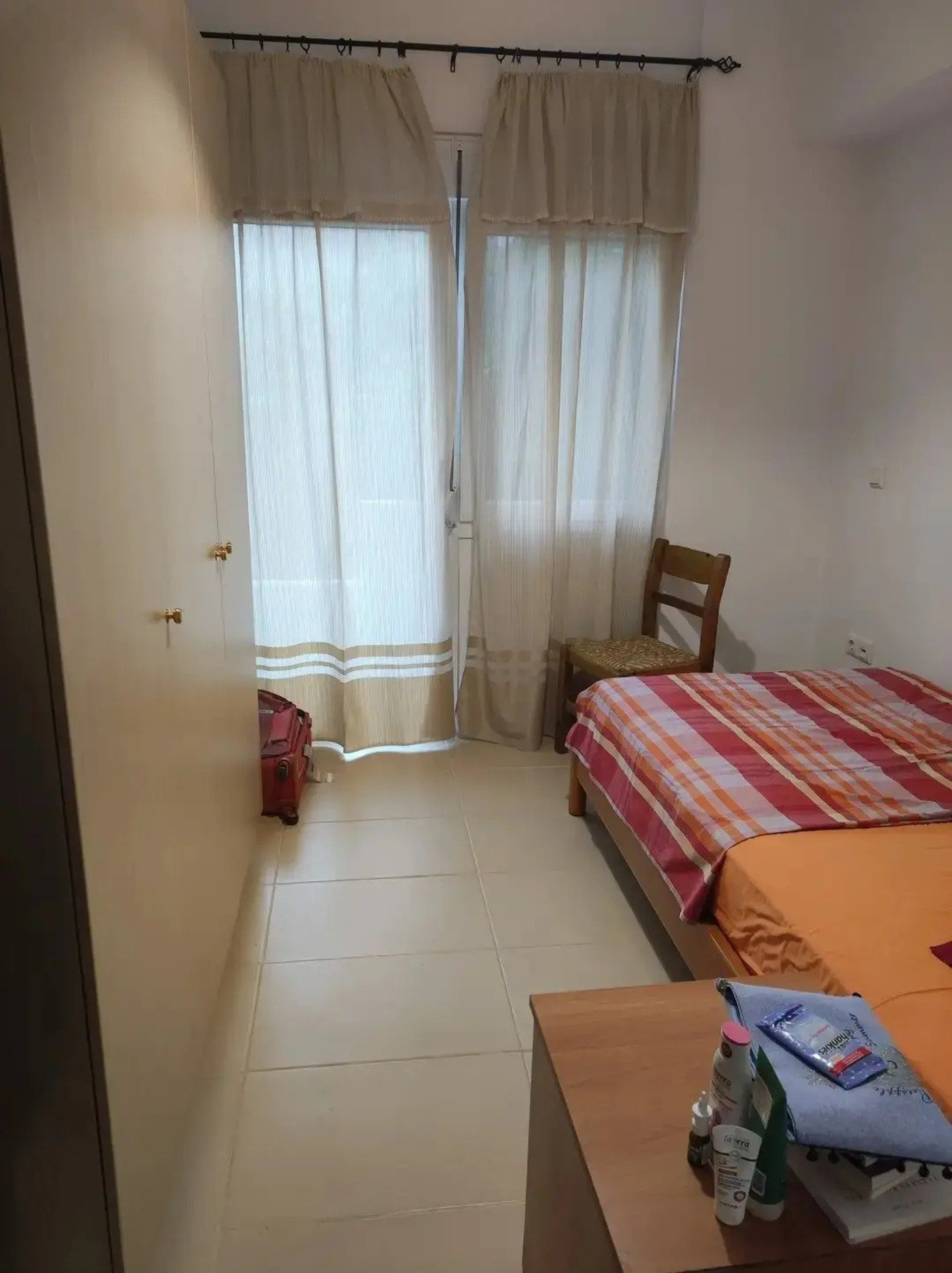 Separate bedroom with balcony and garden view 