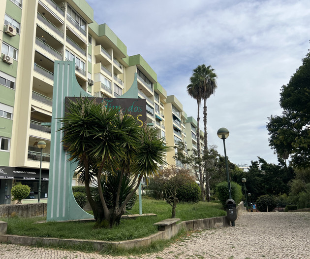 Apartment building exterior with landscaped entrance