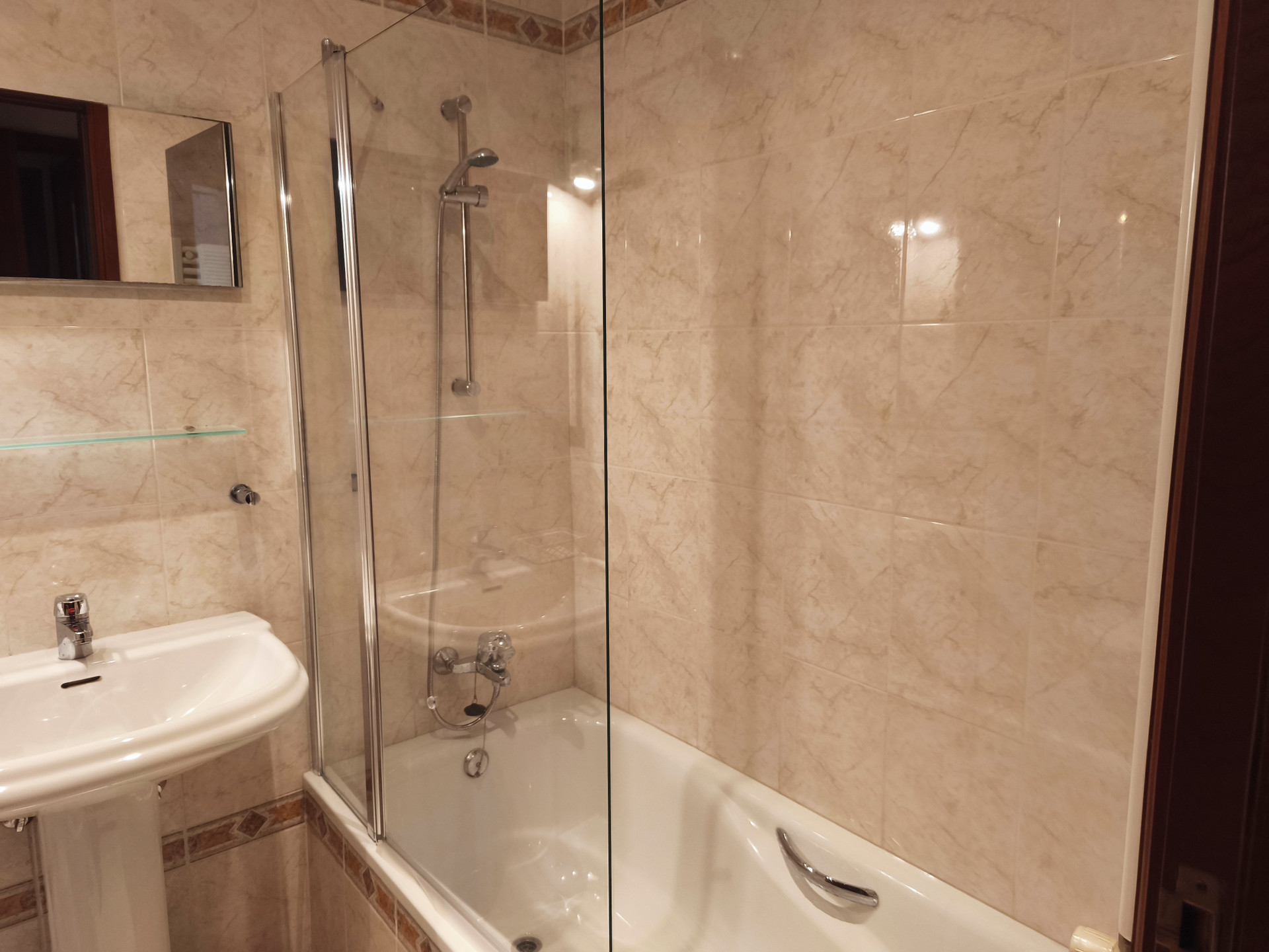 Bathroom with bathtub and shower