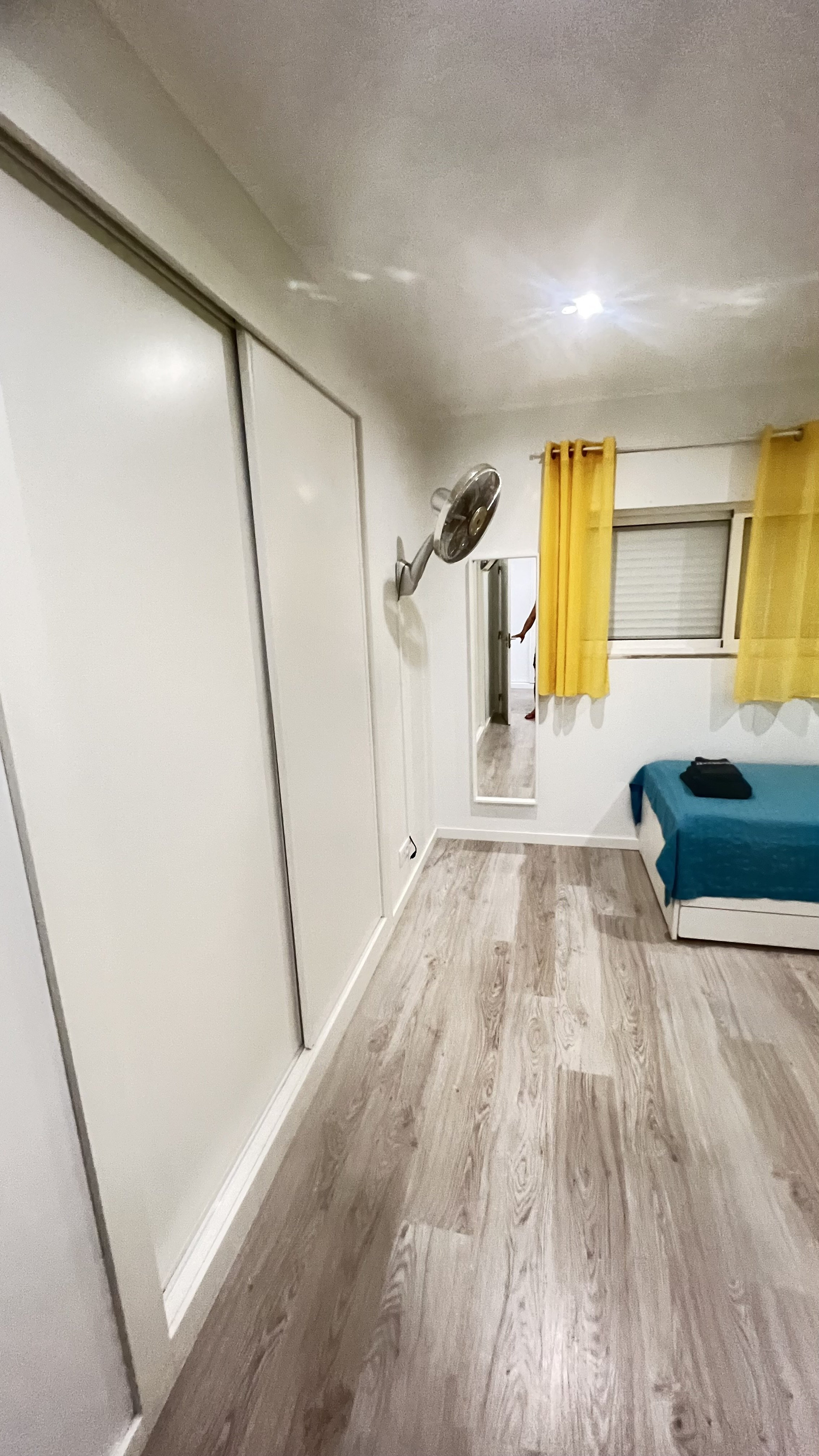Bedroom with wardrobe and window