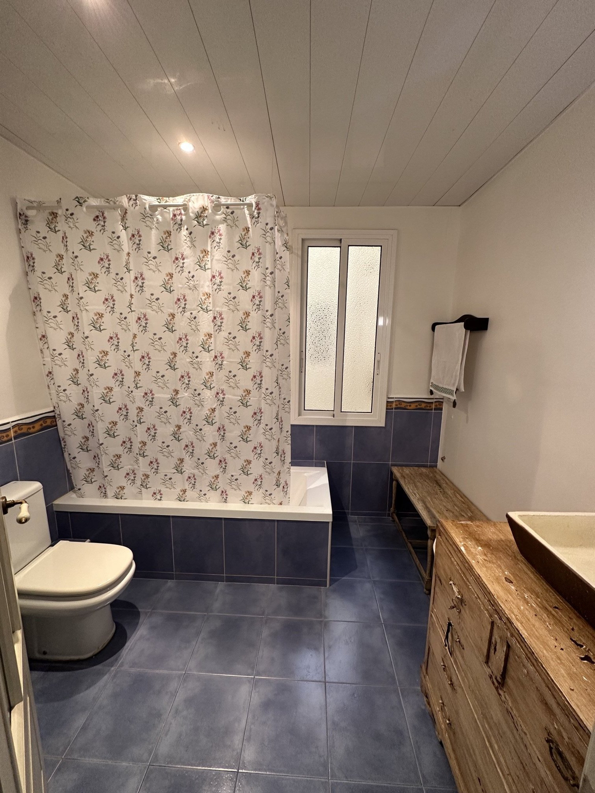 Bathroom with blue tiles and shower