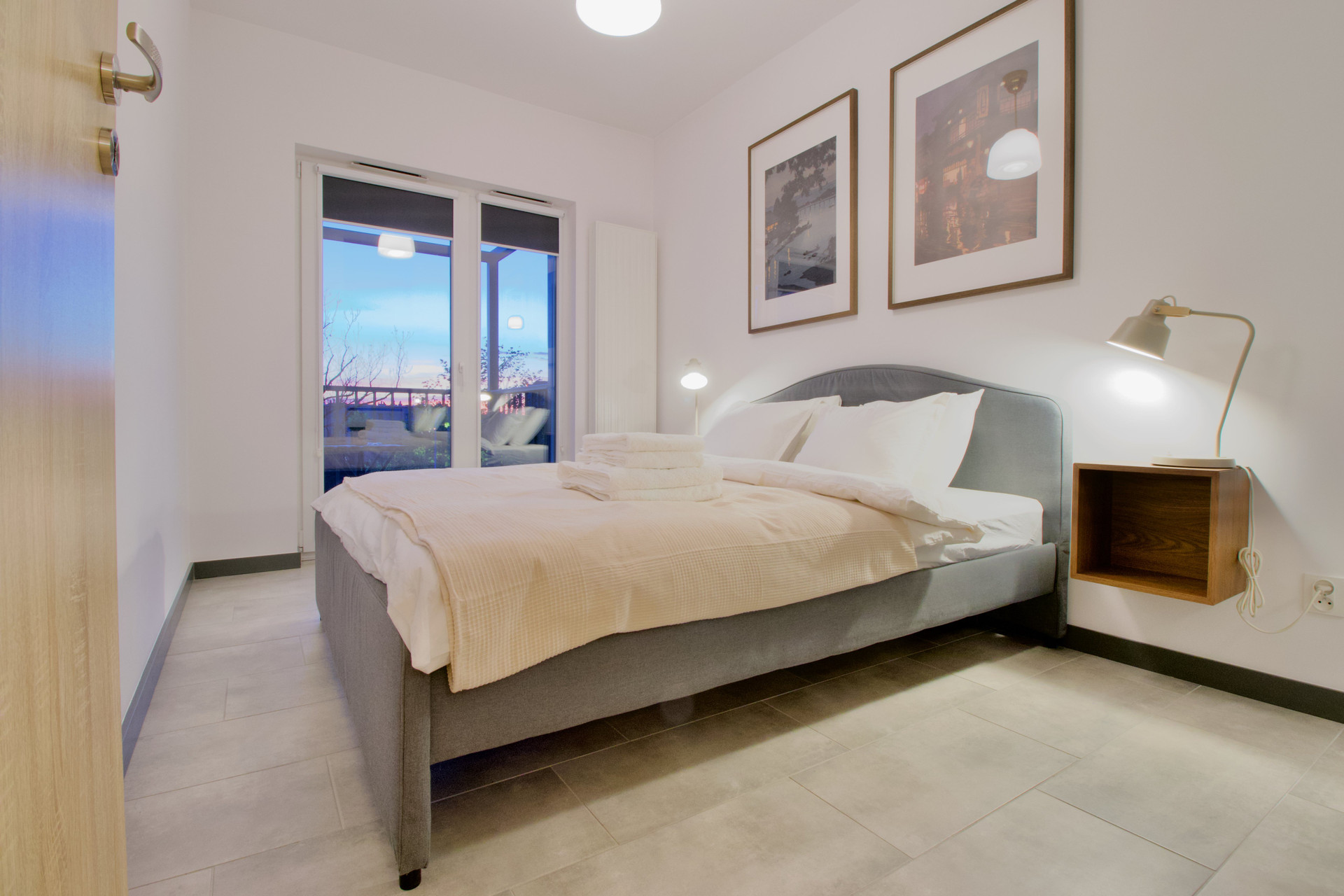 Bedroom with double bed and balcony