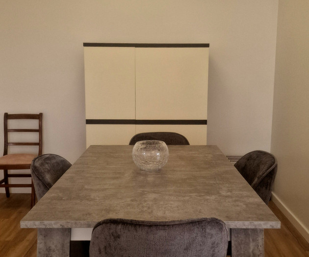 Dining table with cabinet backdrop