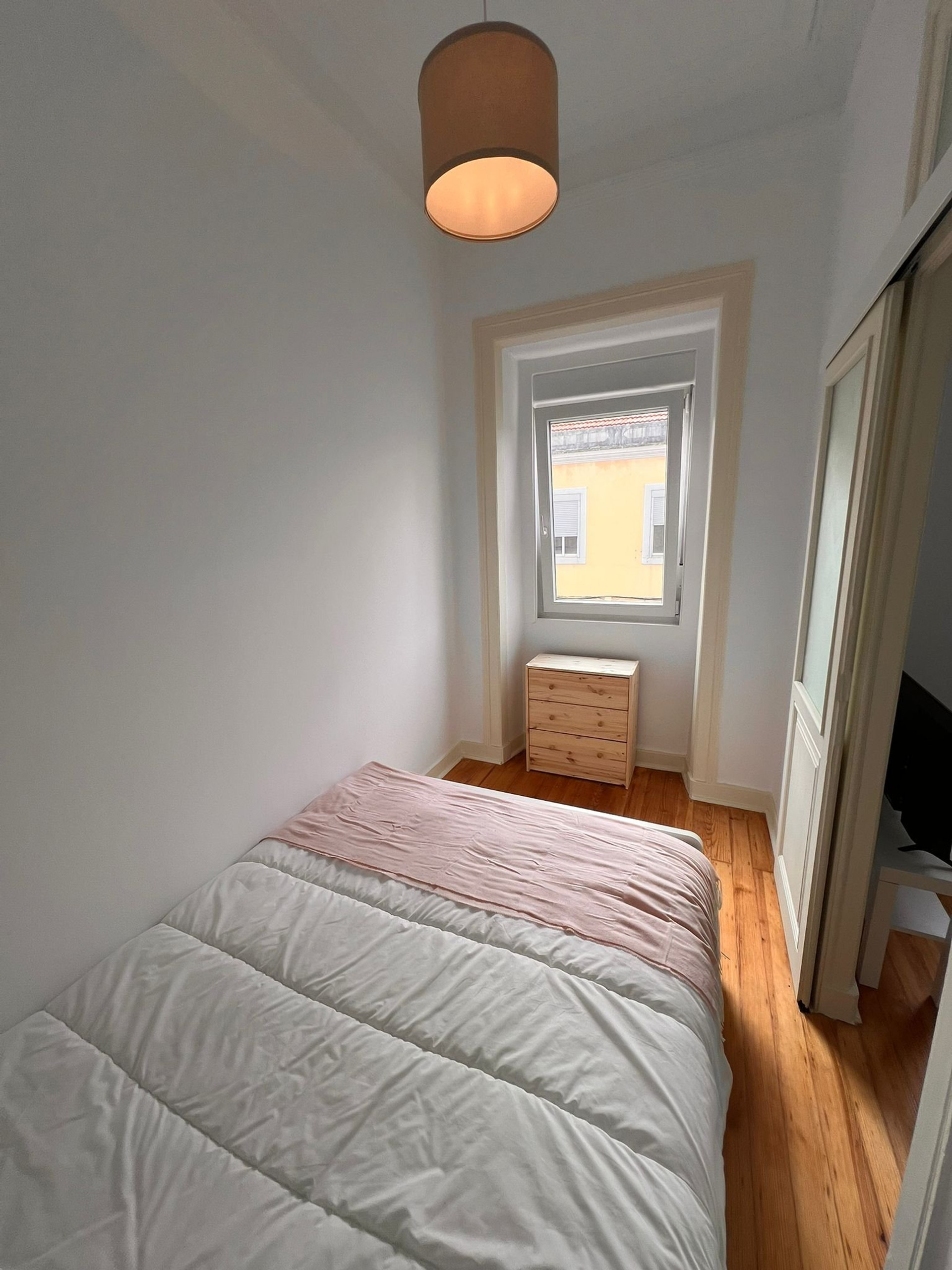 Bright bedroom with double bed