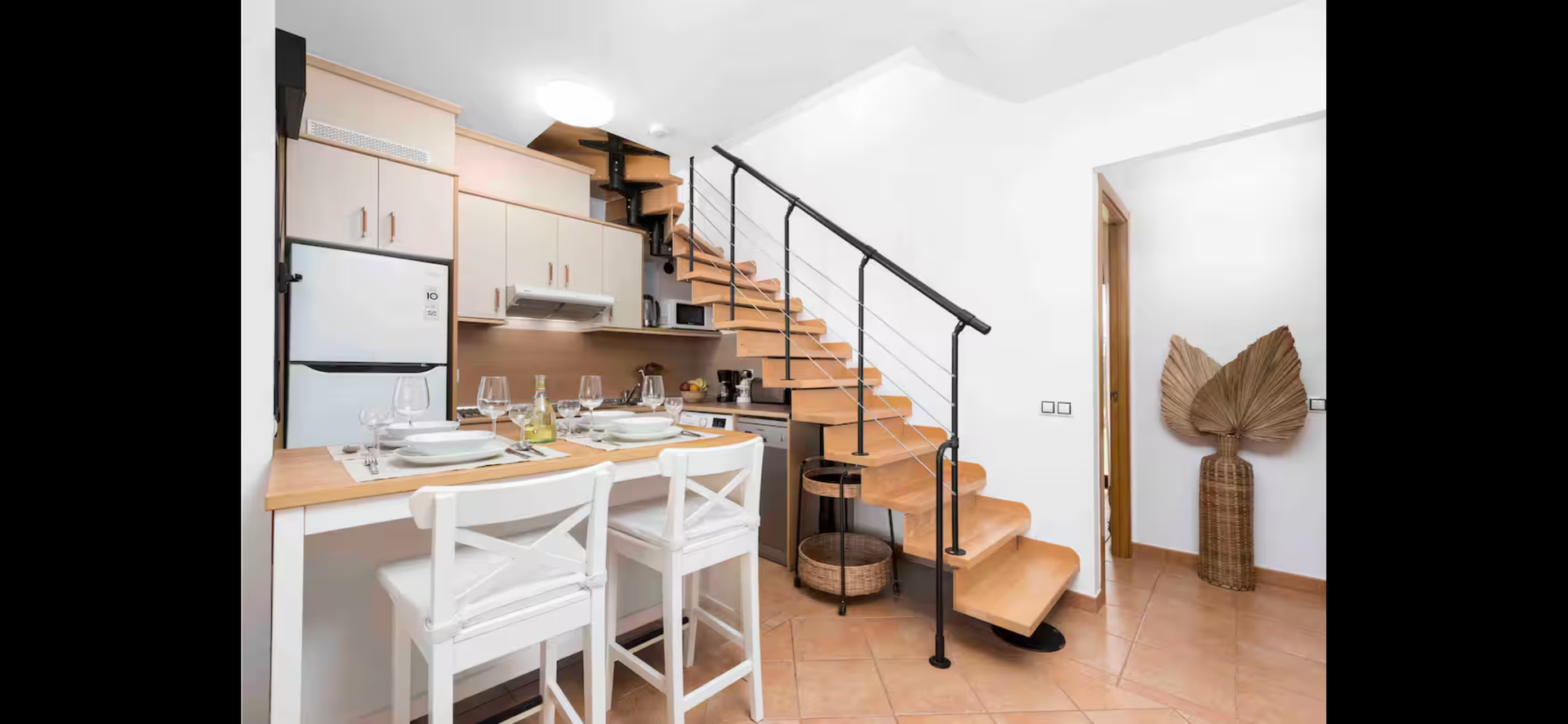 Kitchen and dining with staircase