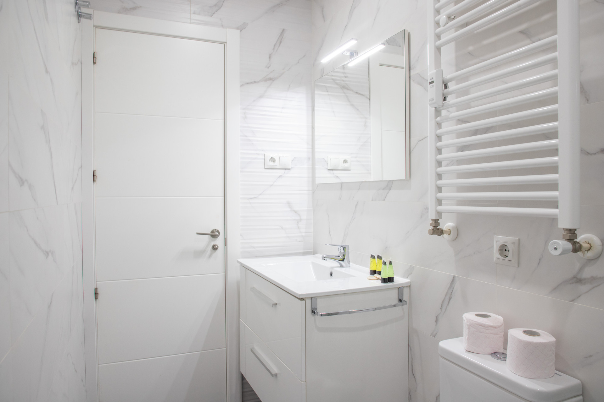 White marble bathroom with vanity