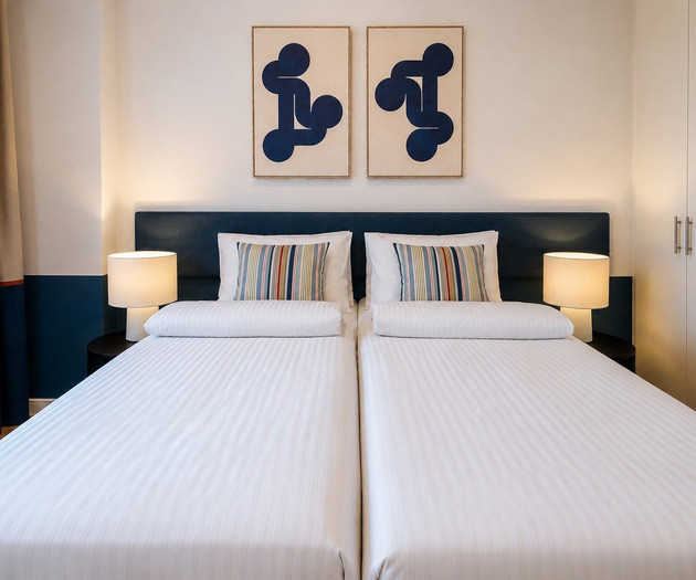 Twin beds with matching lamps