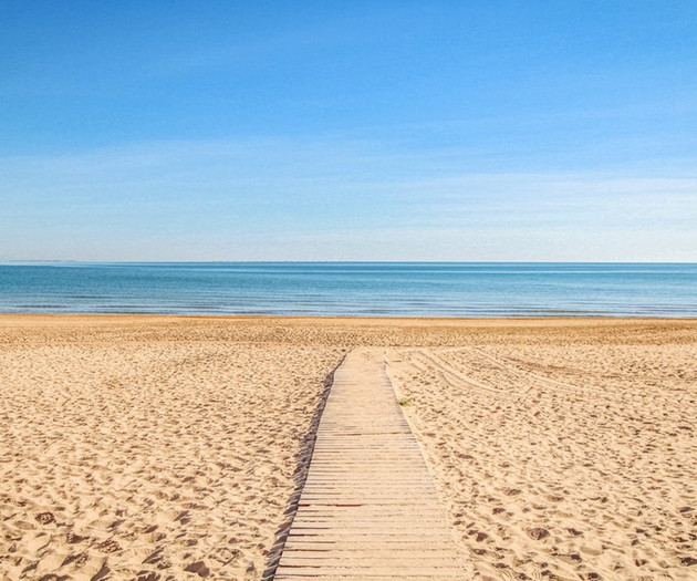 Sandy beach with boardwalk