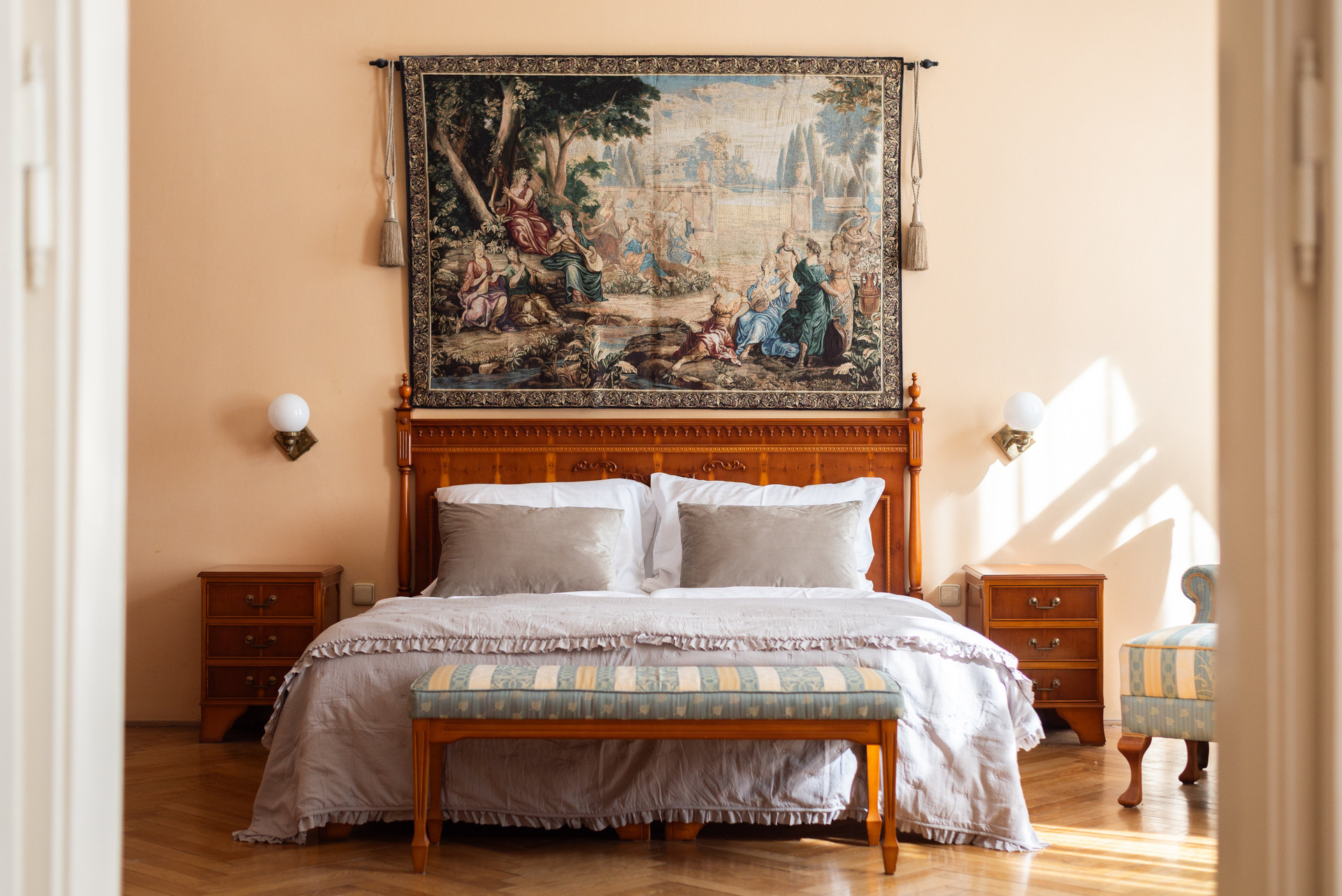 Bedroom with ornate tapestry headboard