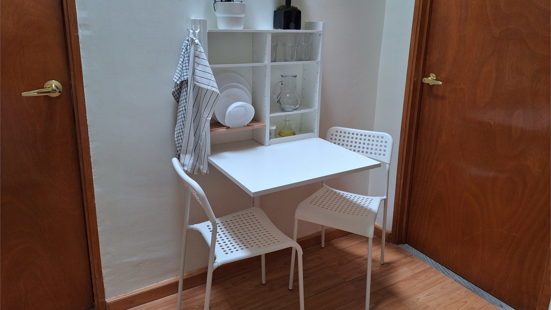 Compact dining area with fold-down table