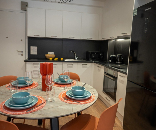 Kitchen dining setup with fridge