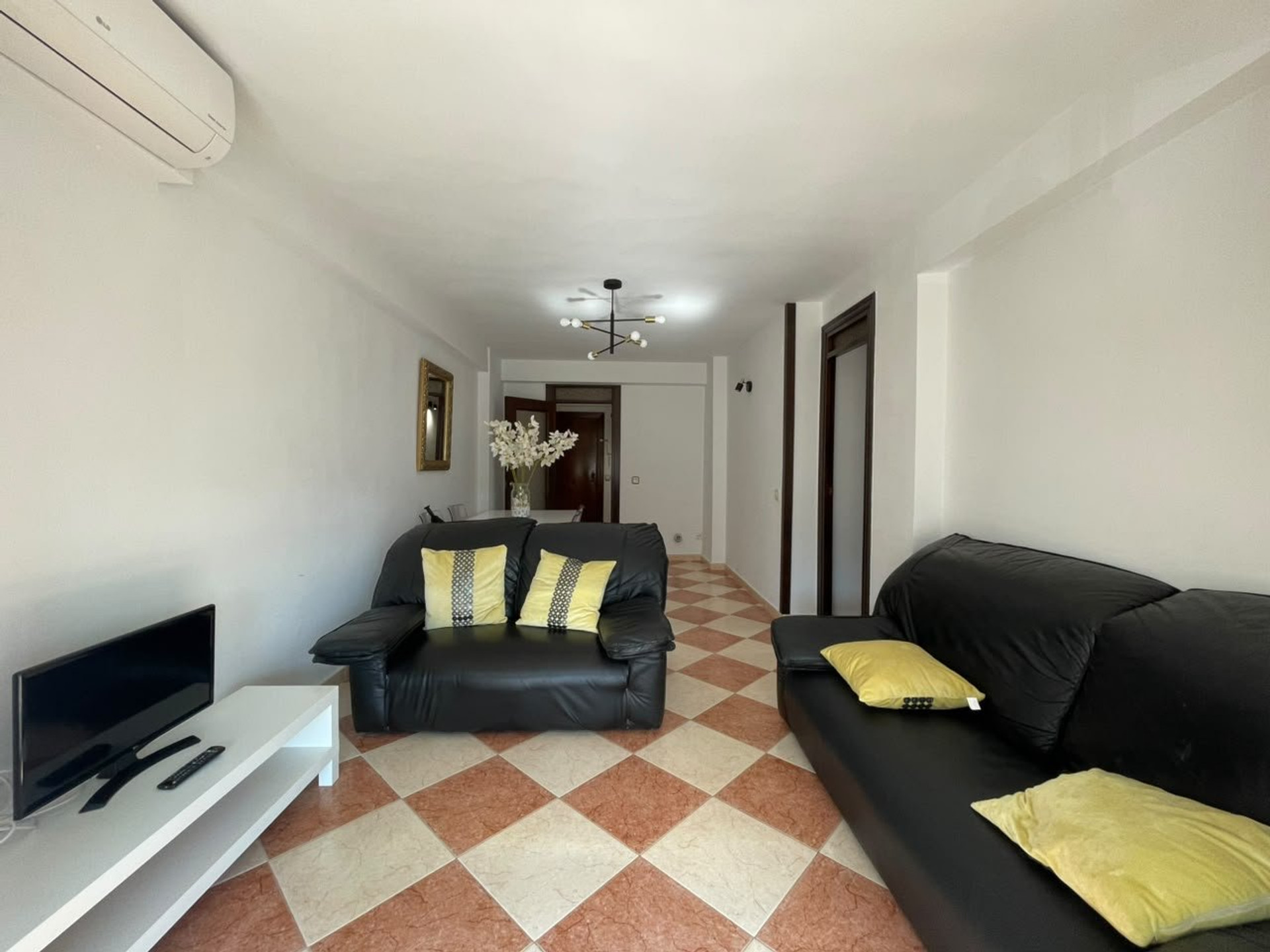 Long living room with two sofas