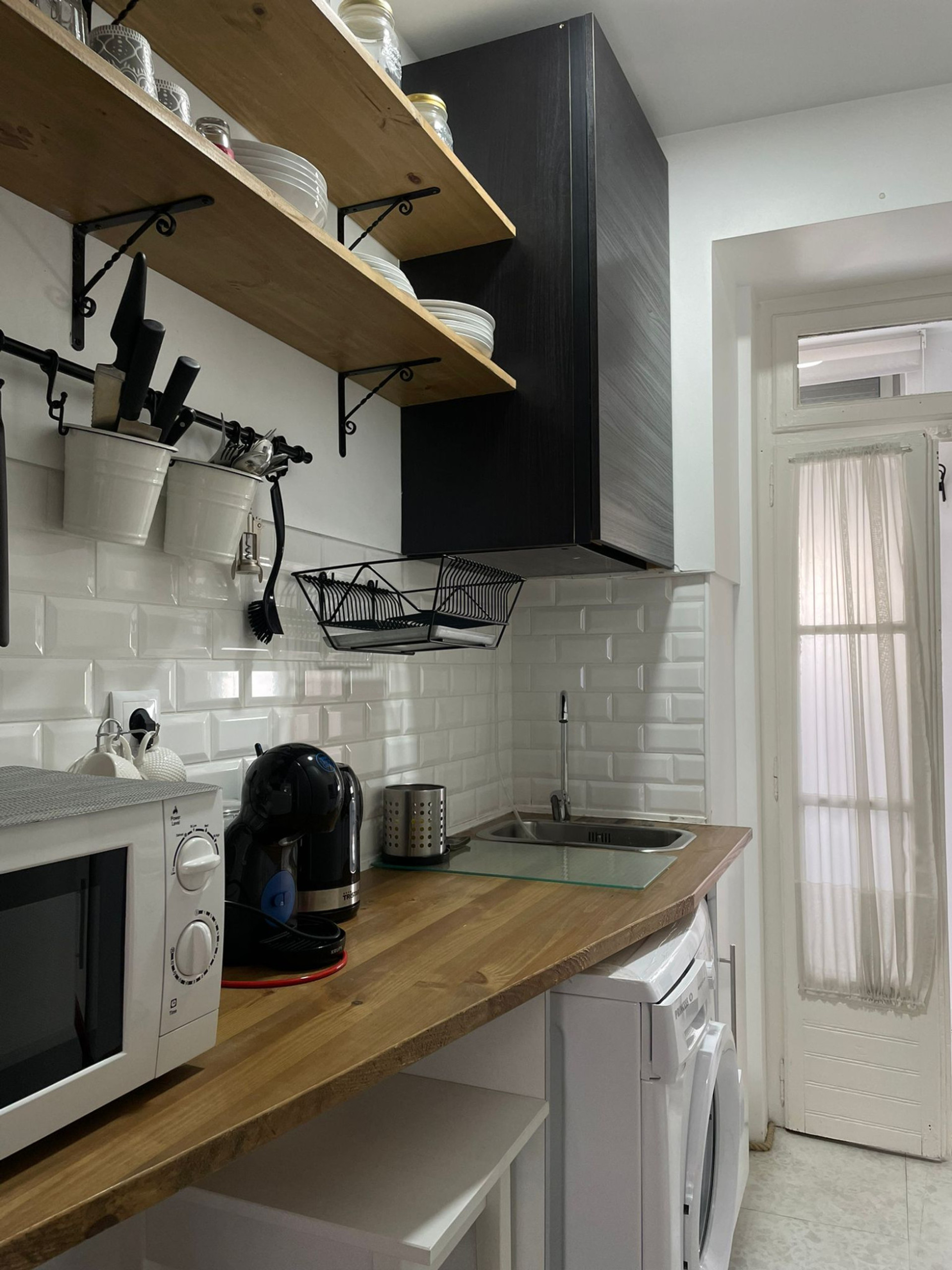 Kitchen with sink and washing machine
