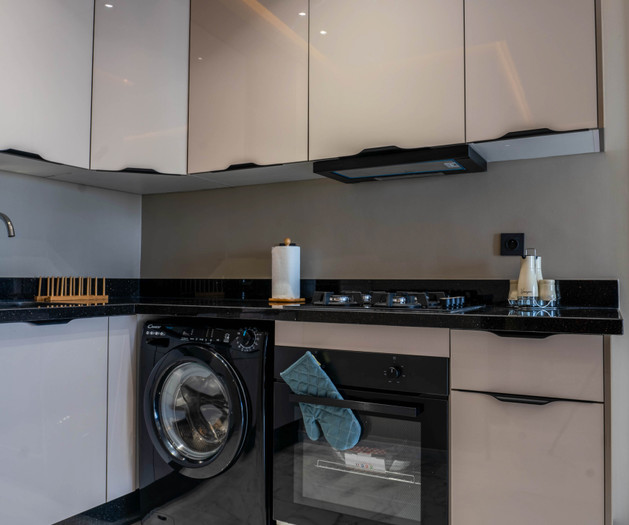 Kitchen with washer and oven