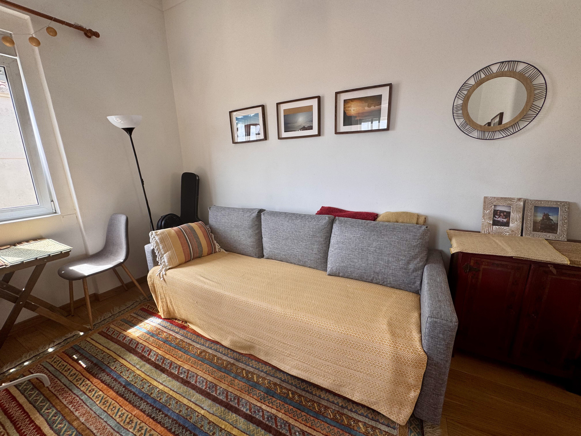 Cozy sitting area with sofa and art