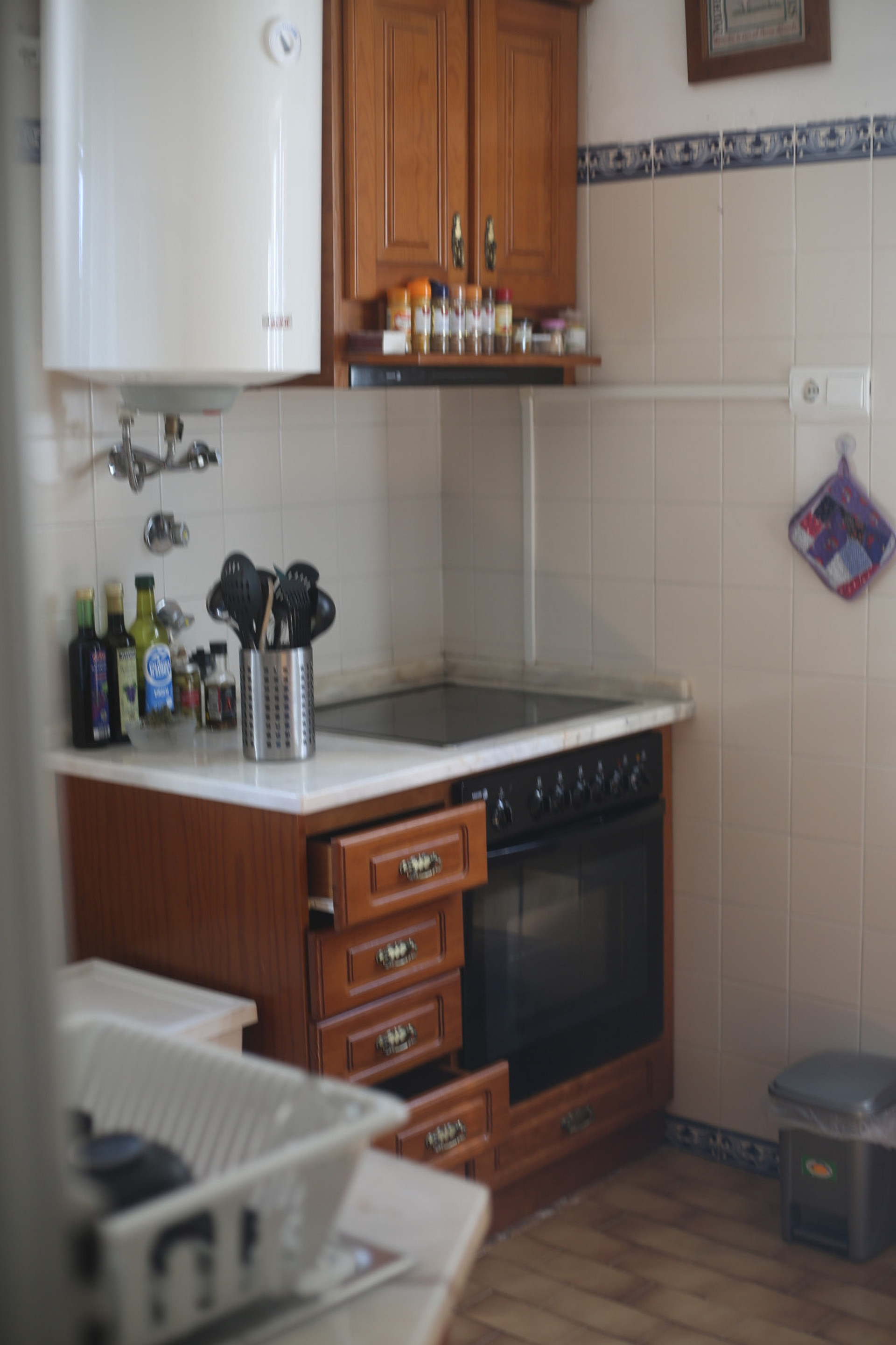 Kitchen with wooden cabinets and oven