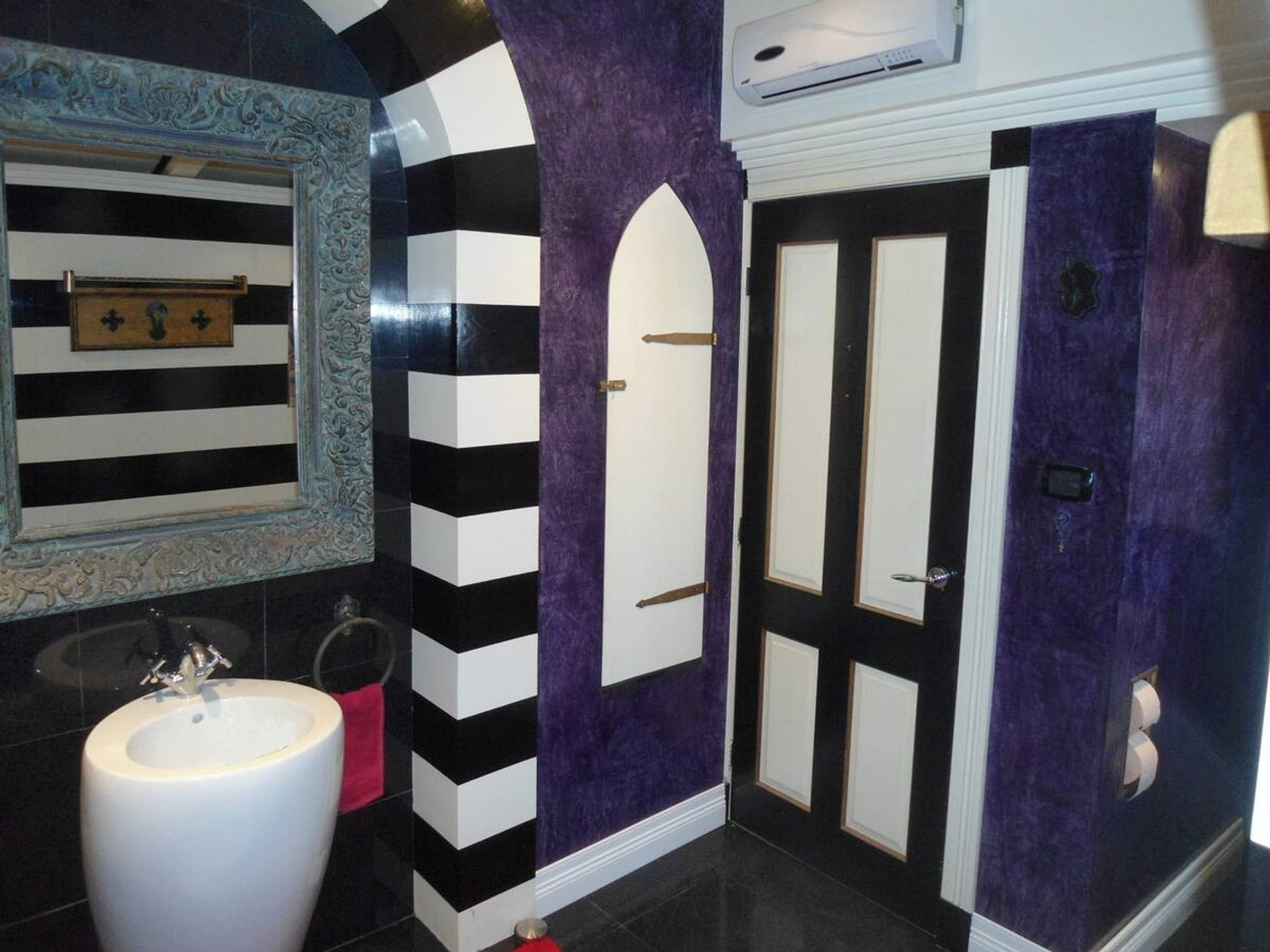 Gothic-style bathroom with pedestal sink
