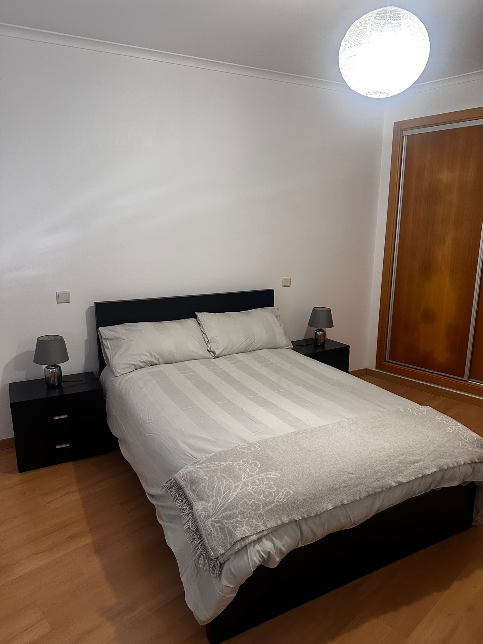 Bedroom with black bed frame
