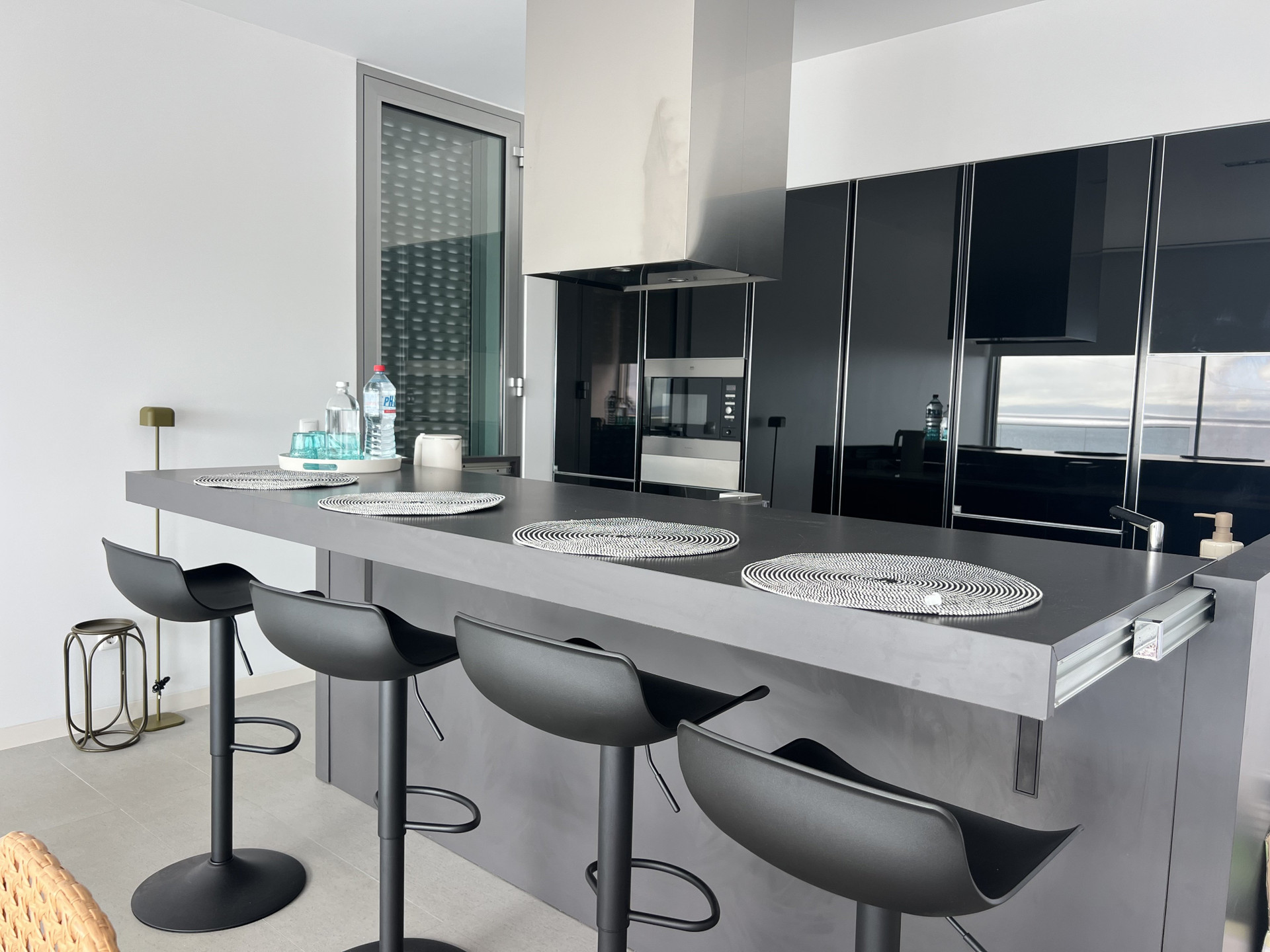Sleek kitchen island with barstools