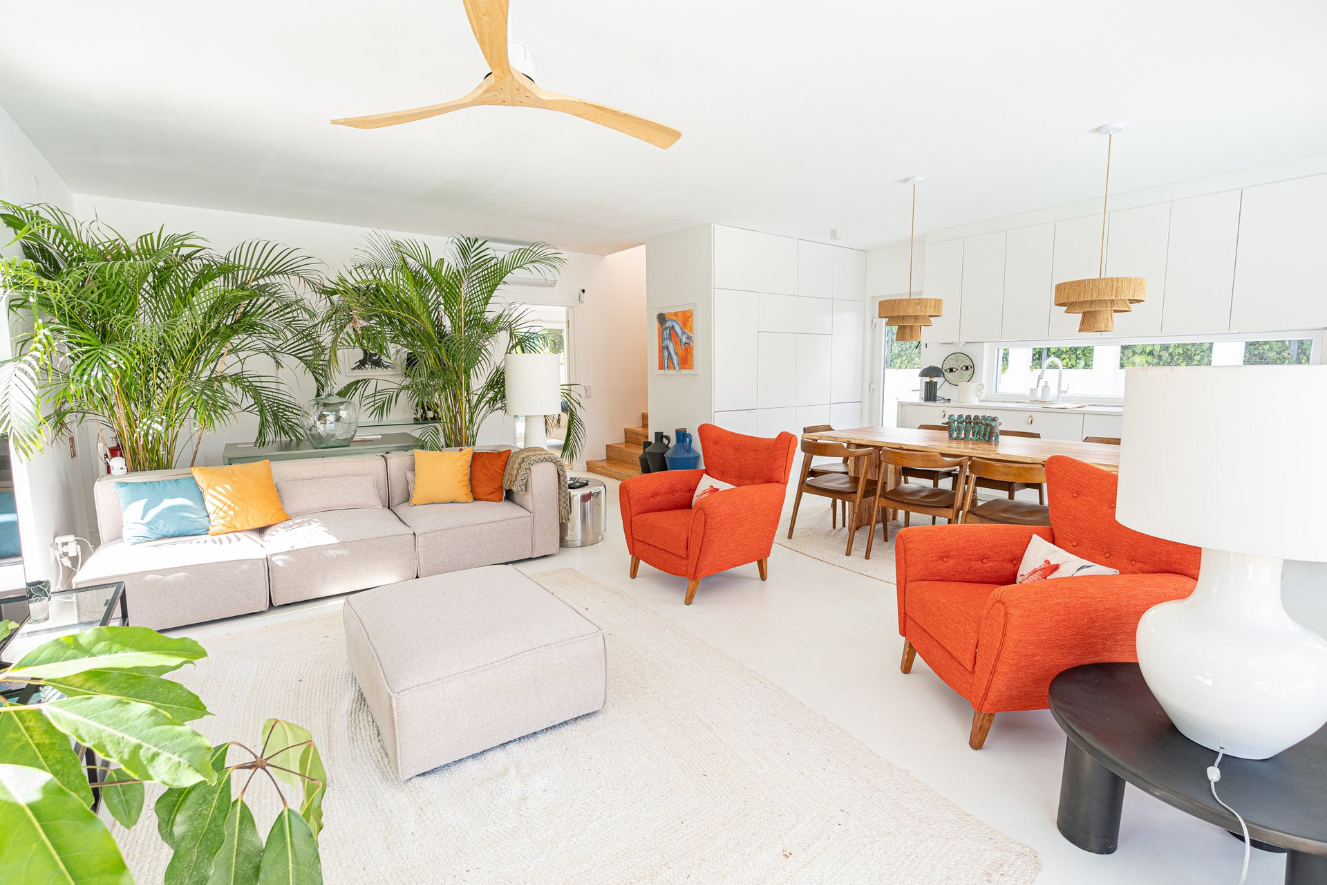 Open living room with colorful armchairs
