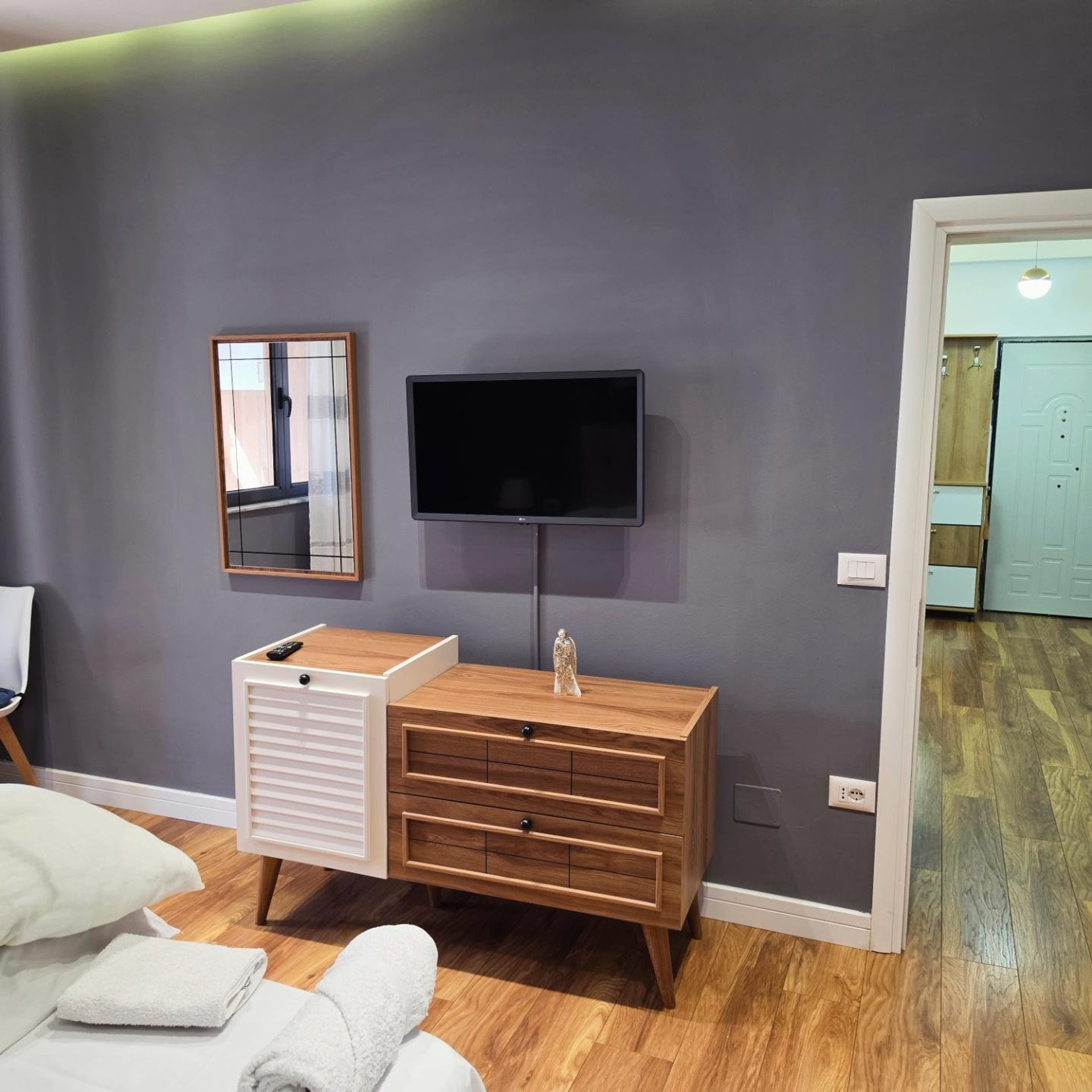 Bedroom with TV and dresser