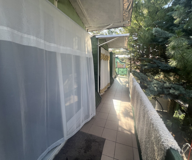 Covered balcony with curtains