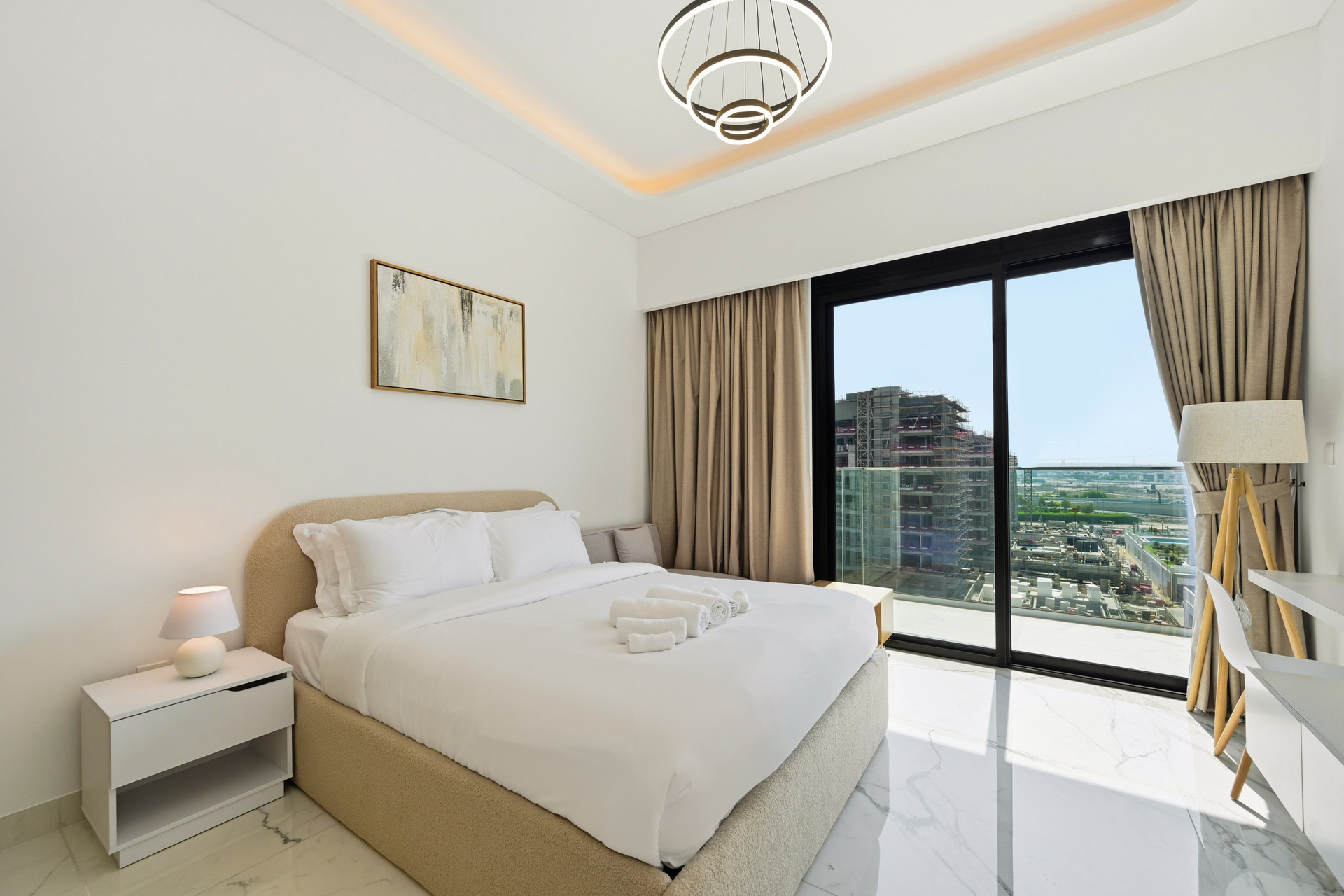 Bedroom with city view balcony