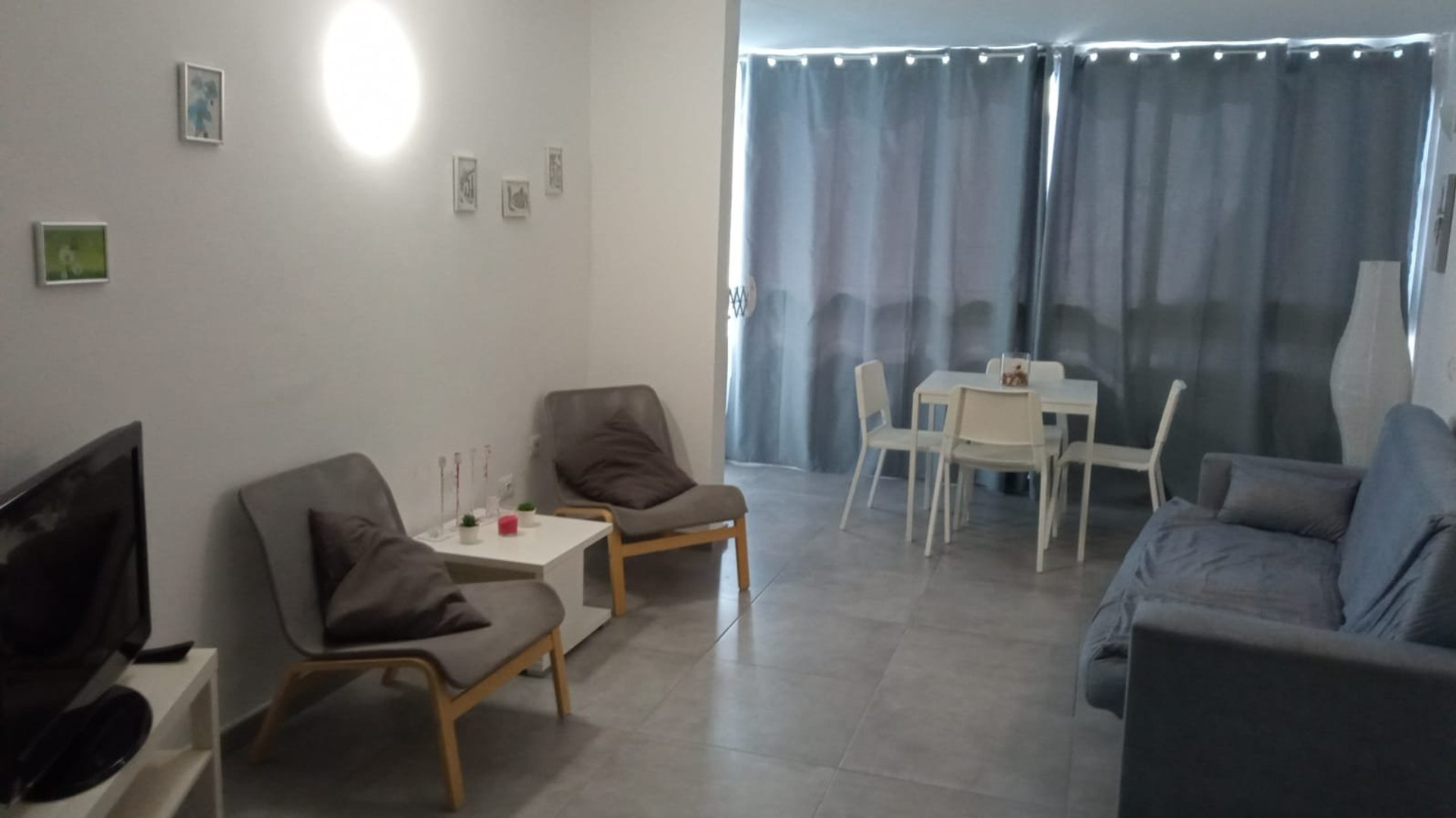 Living area with sofa and dining table